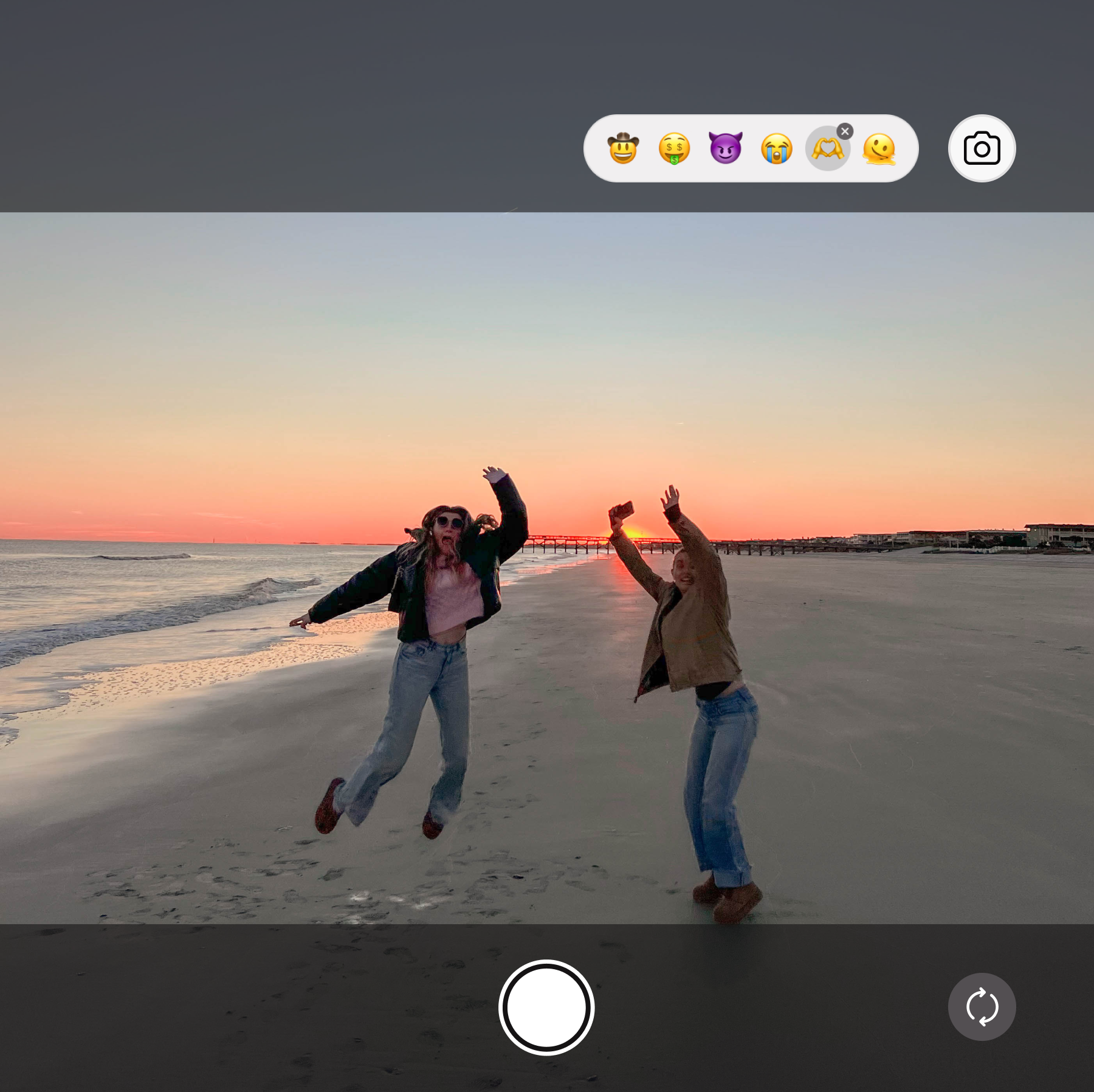 Friends enjoying the sunset together on the beach