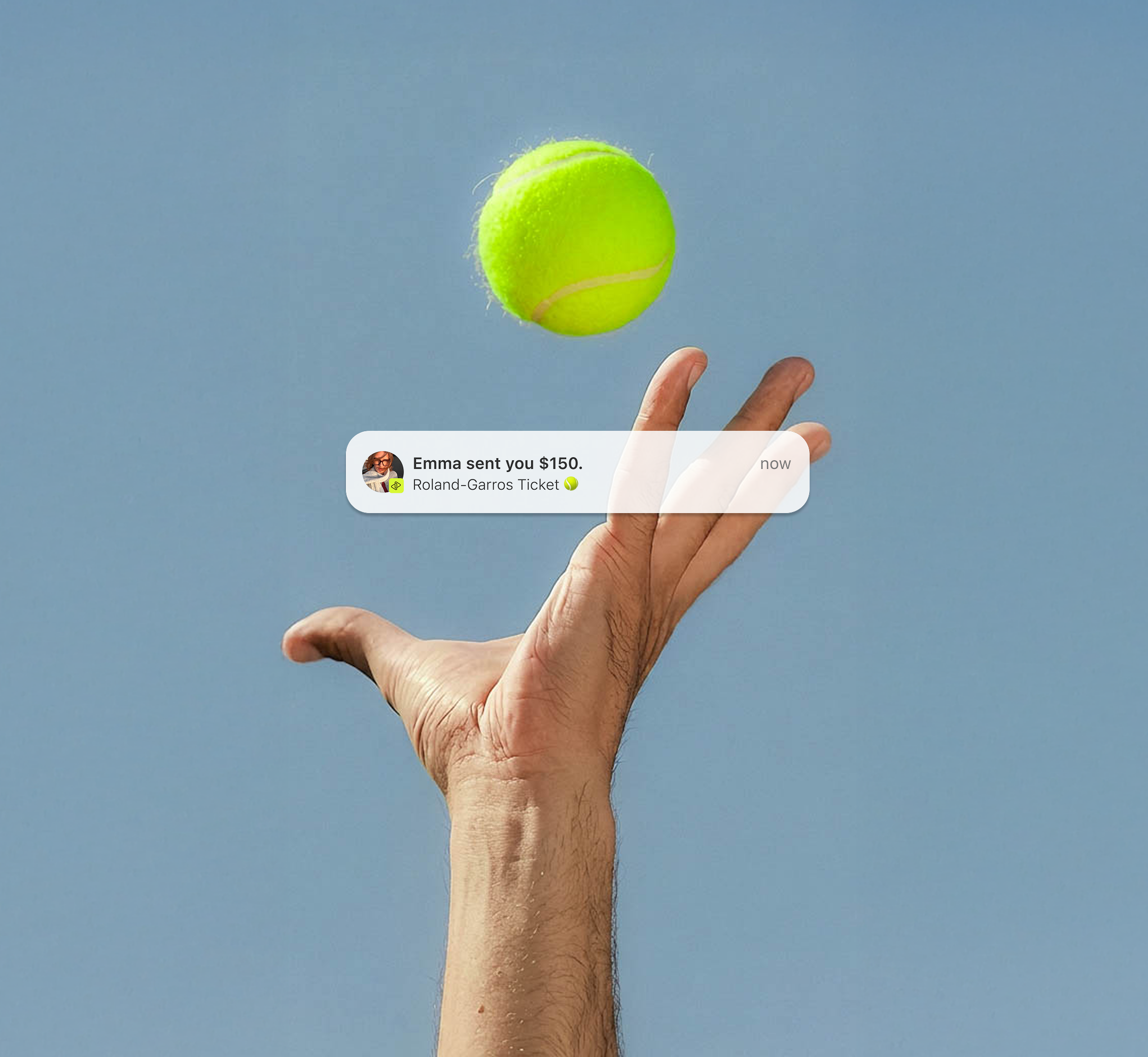 Tennis player's hand catching a ball.