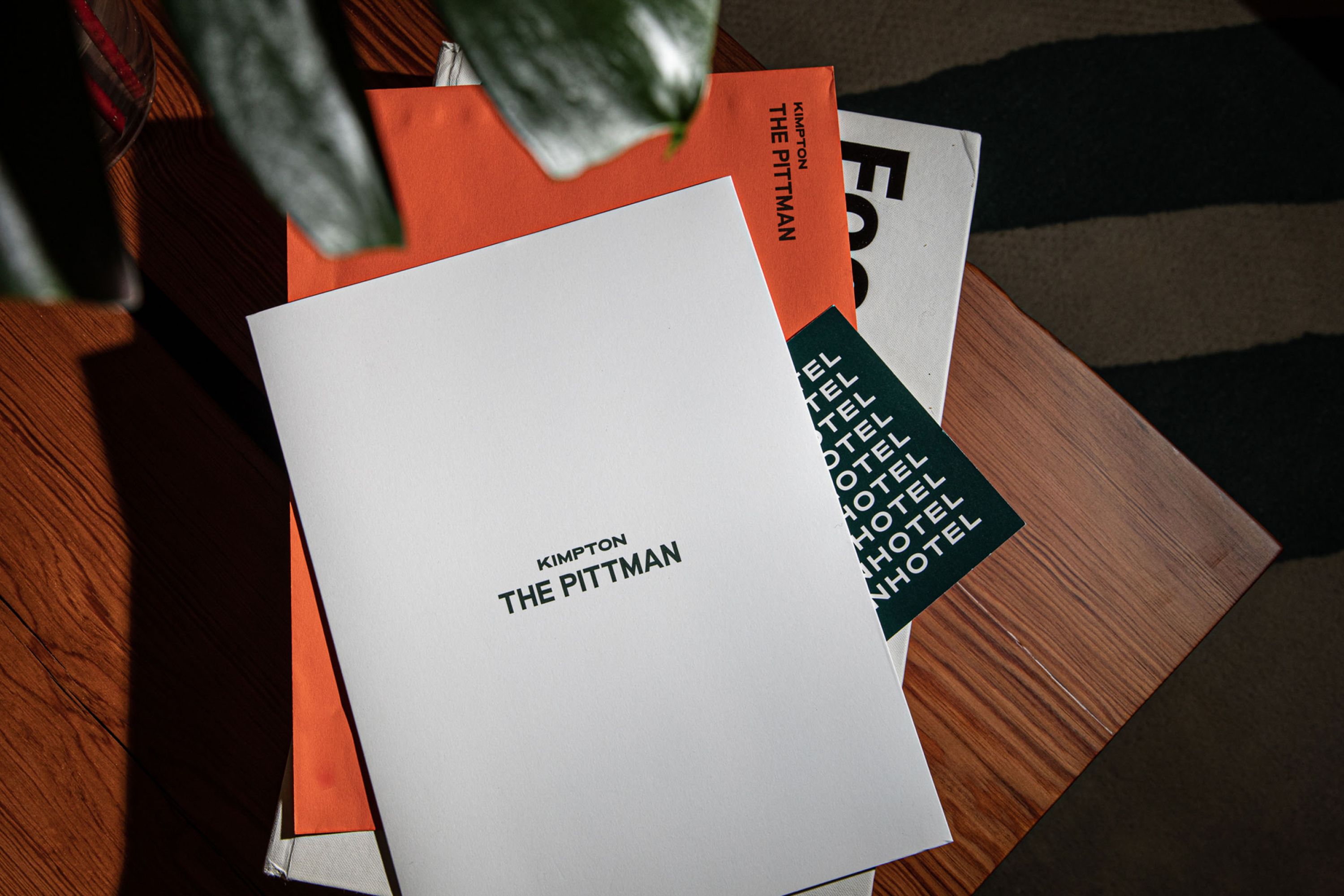 Stack of print assets for The Pittman in Deep Ellum