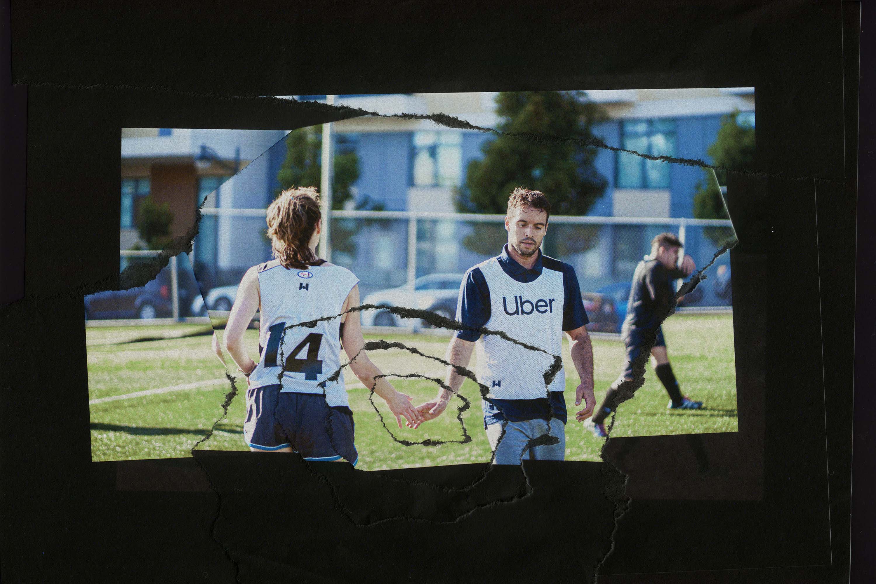 Two teammates giving one another a high five on the field