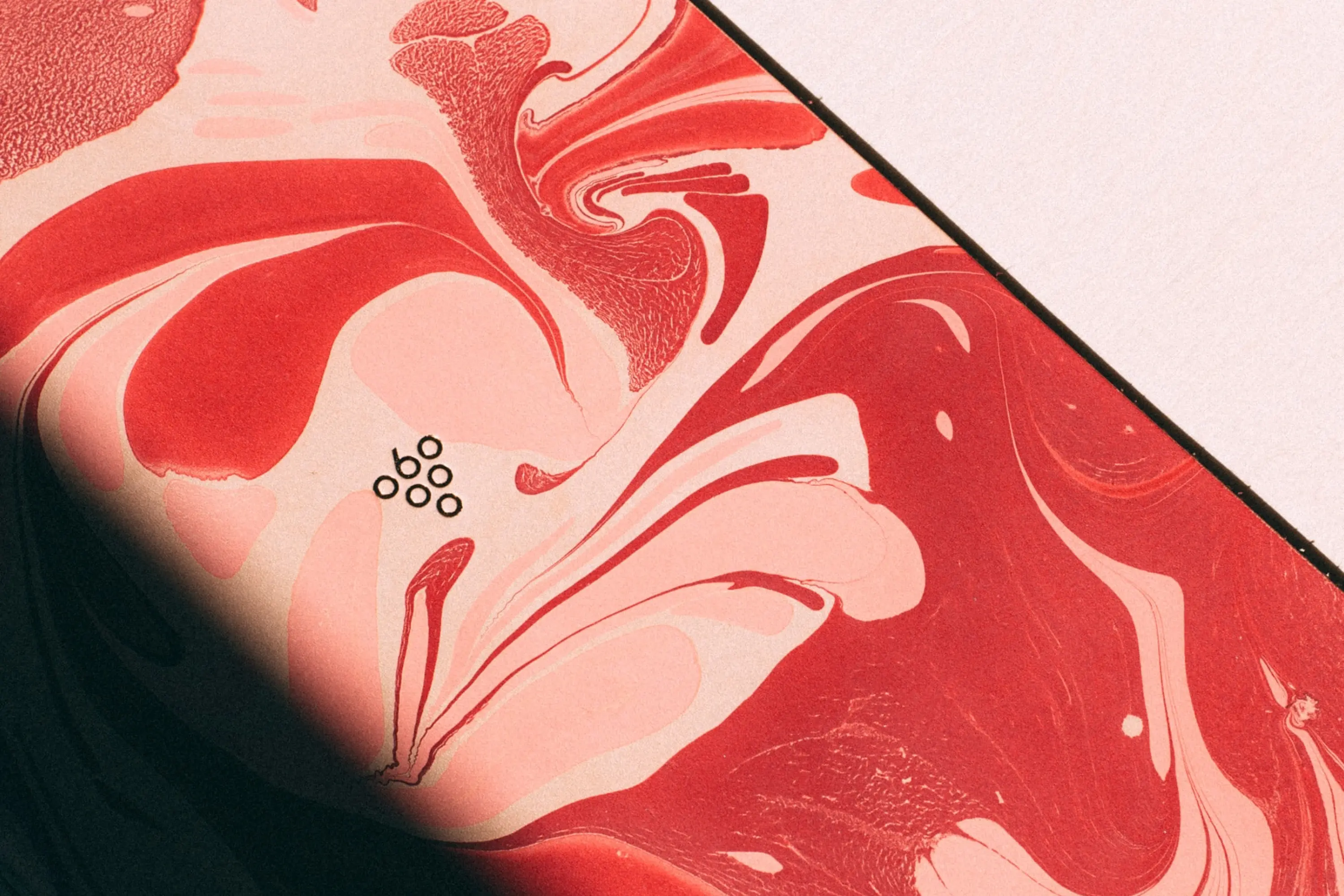 Sixty Vines logo on a red and pink background with an organic design