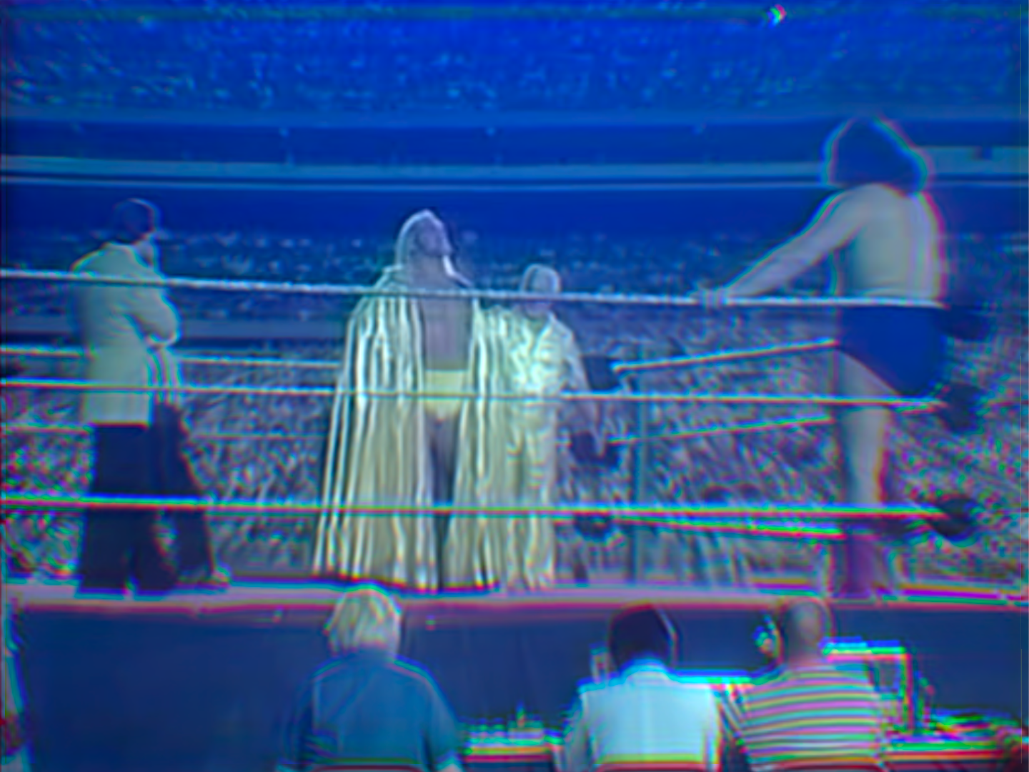 Hulk Hogan stands across the ring from André the Giant at Shea Stadium