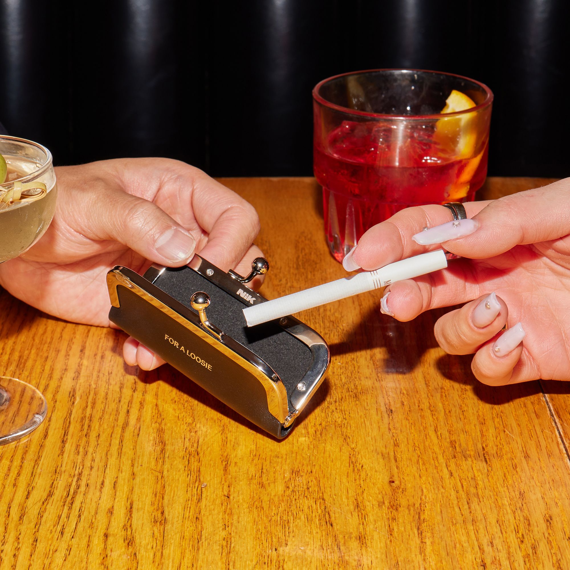 loosey cigarettes A small pile of loose sits on a wooden table Stock Photo Nik Bentel Studio - The