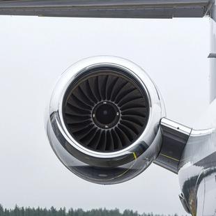 a close up of a private jet engine on a runway .
