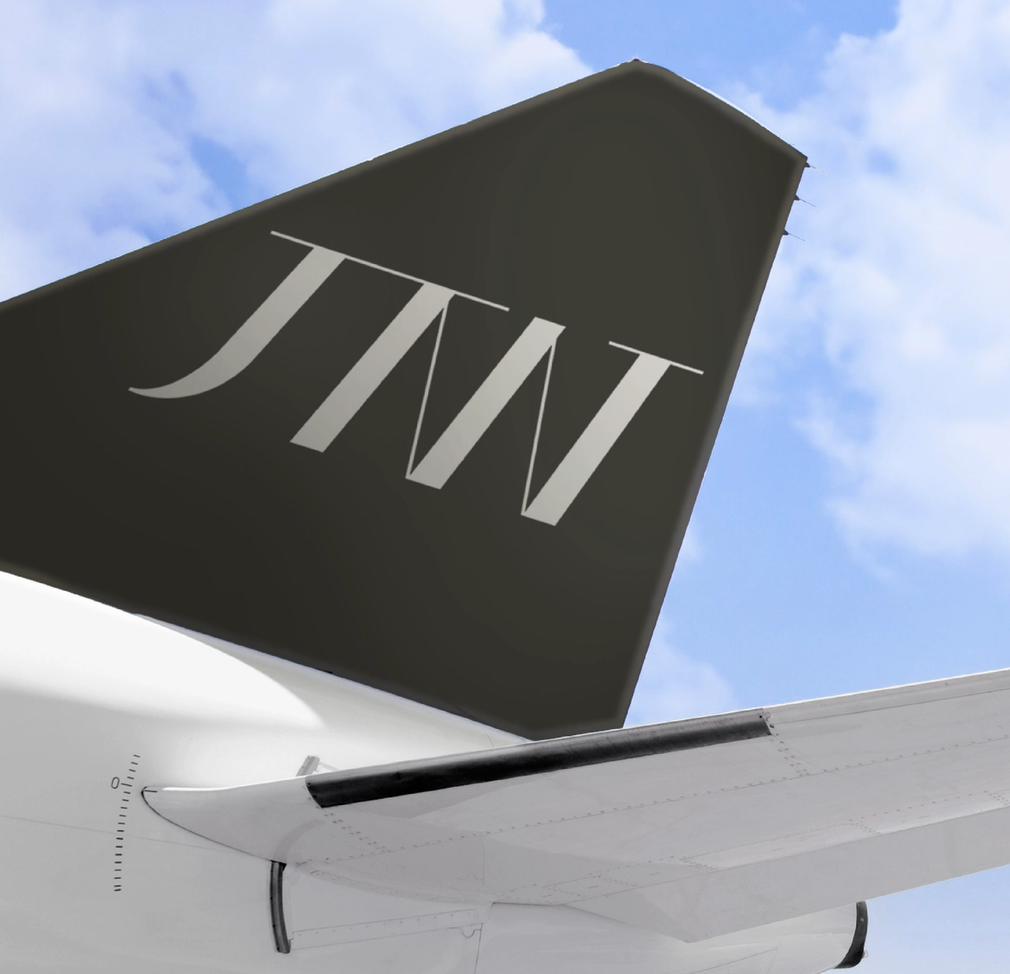 The tail of a jet with the letters jtw on it