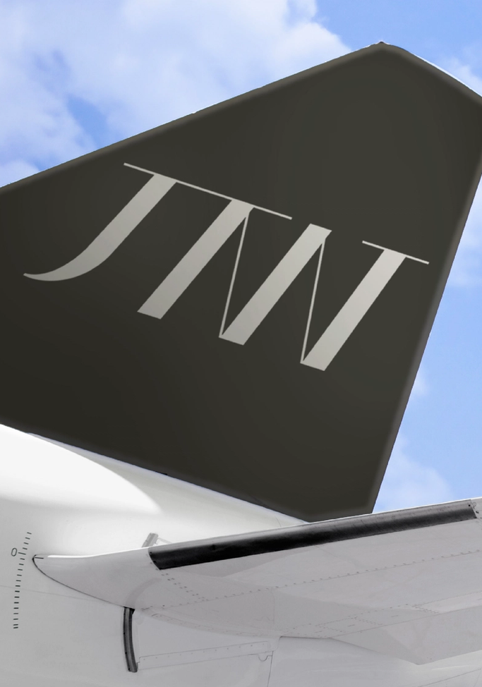 Black tail of jet with JTW logo