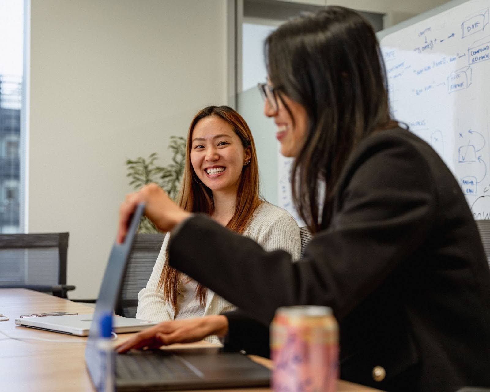 Two Harvey employees laughing