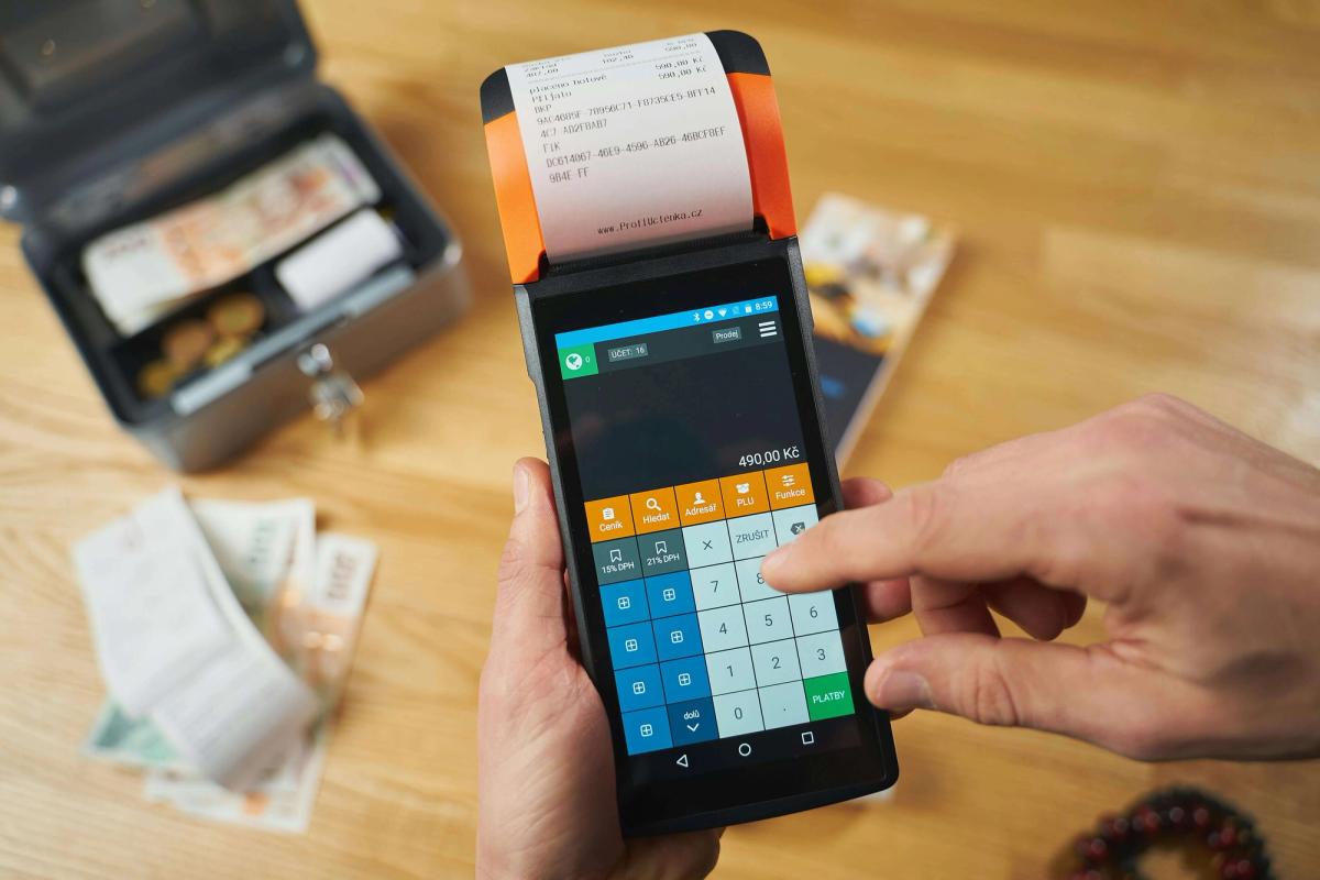 Payment terminal in hands.