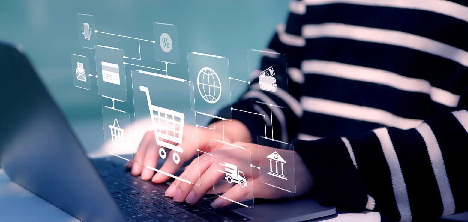 Man working on a laptop with digital icons representing e-commerce integration appearing around the screen.
