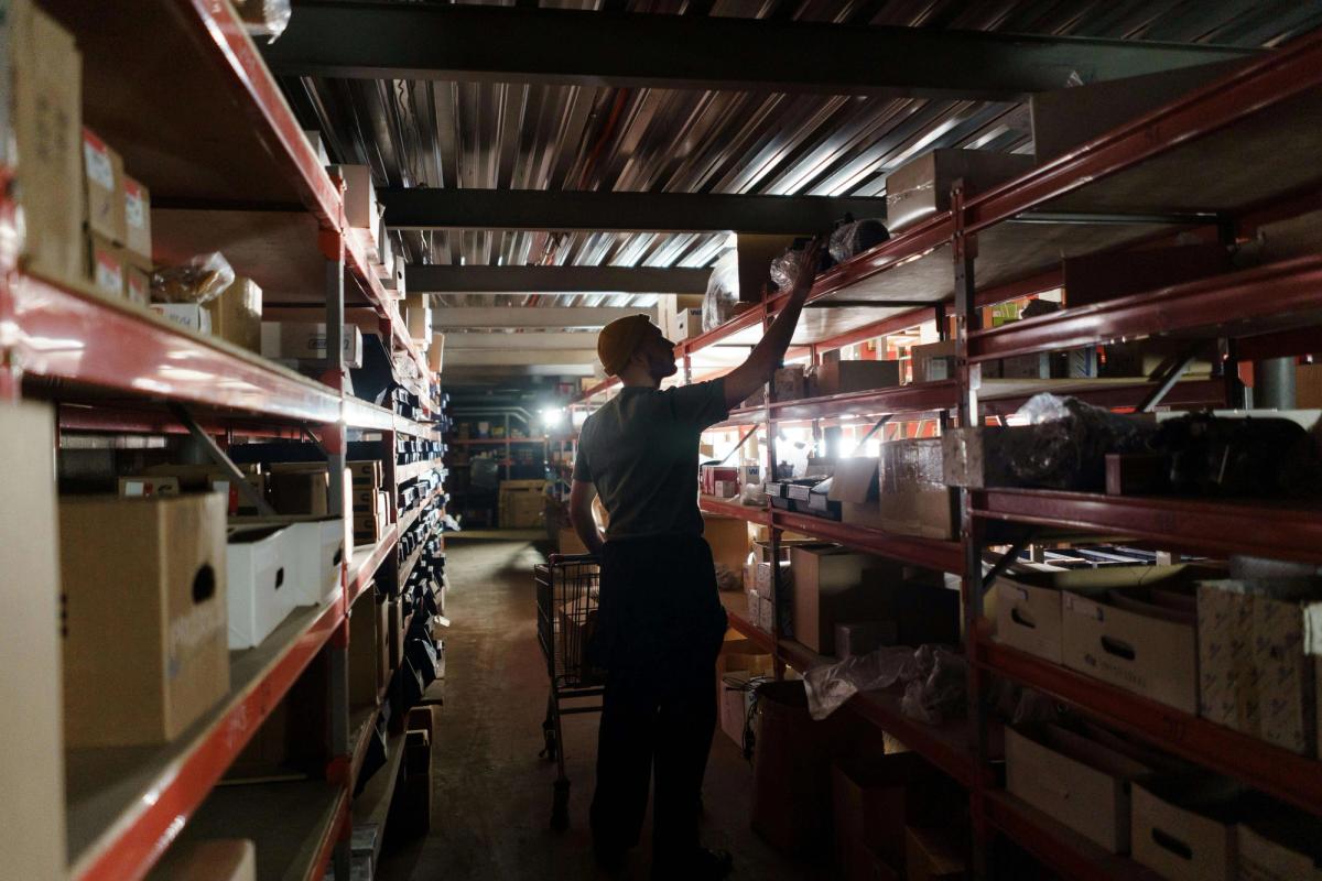 A man arranging in a depo.