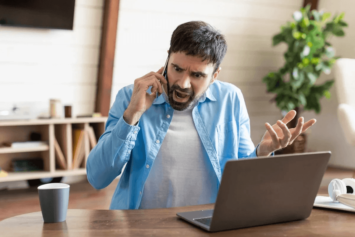 A frustrated man talking to someone in the phone.
