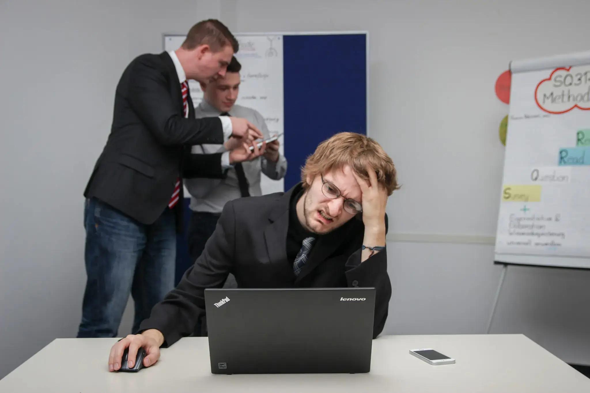 A problematic man scratching his head.