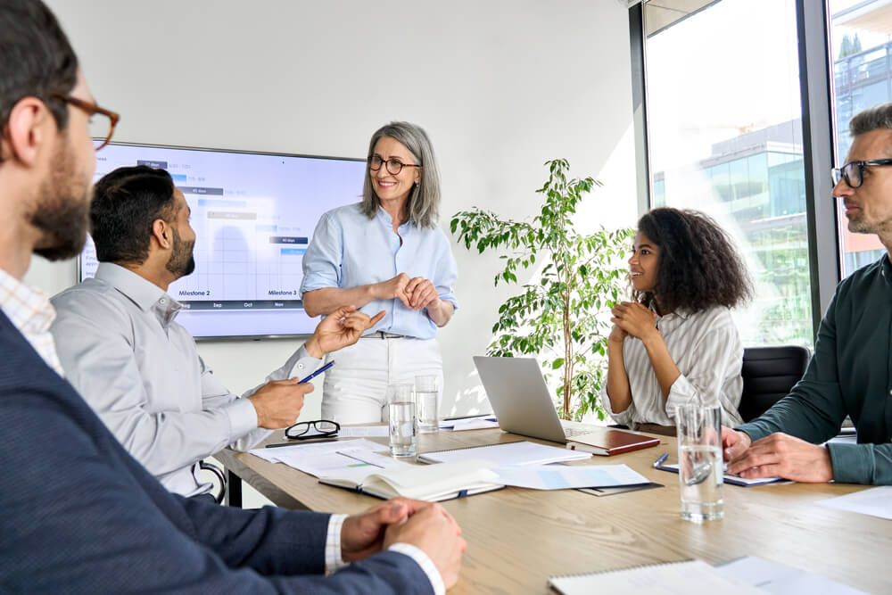 A group of people attending a training session in a room.