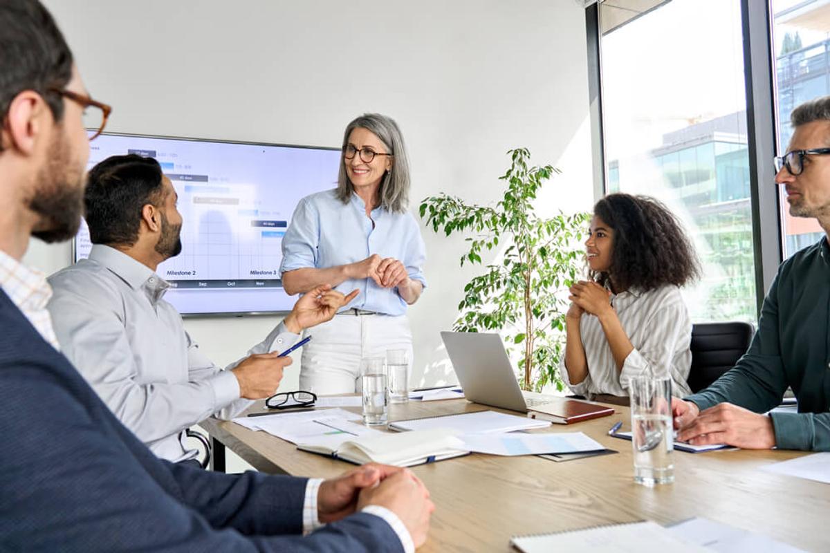 A group of people attending a training session in a room.