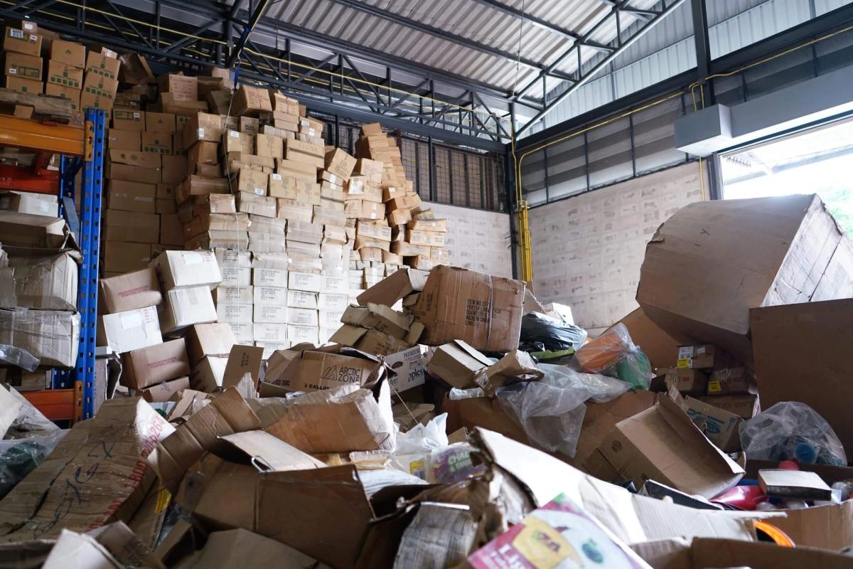 A disorganised stack of boxes in a warehouse, indicating clutter or mismanagement.
