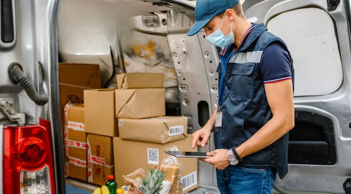 A delivery man inspecting his packages.
