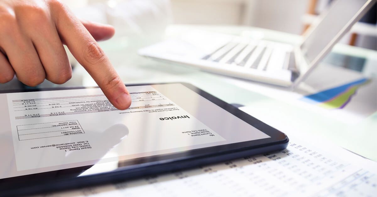 A finger navigating in a tablet.