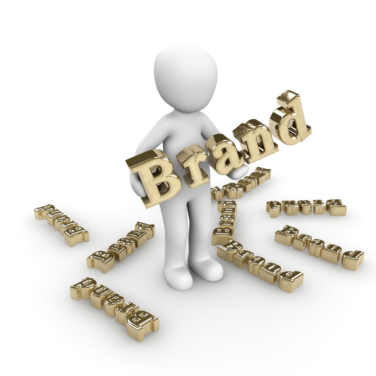 A 3D man stands in gold letters, representing branding and marketing.