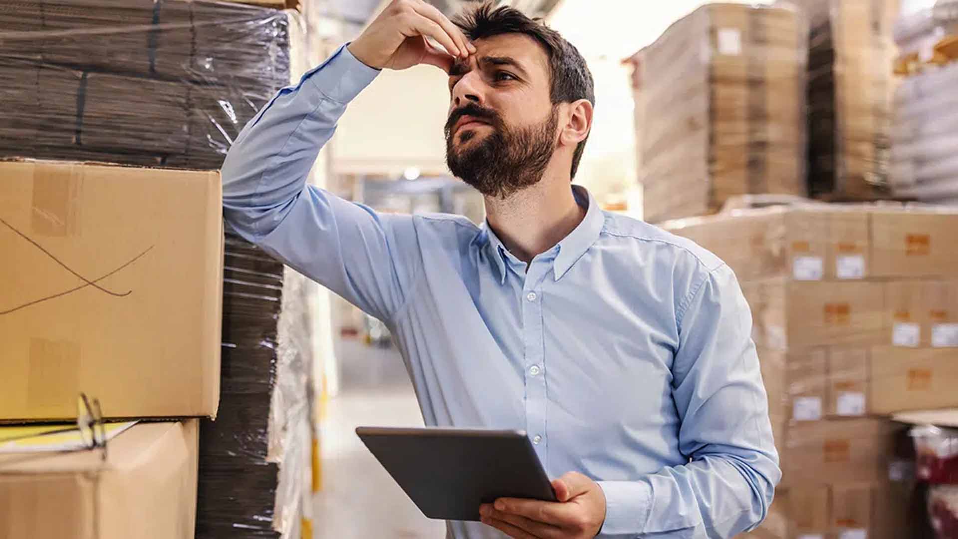 A man holding his head to show frustration or stress.