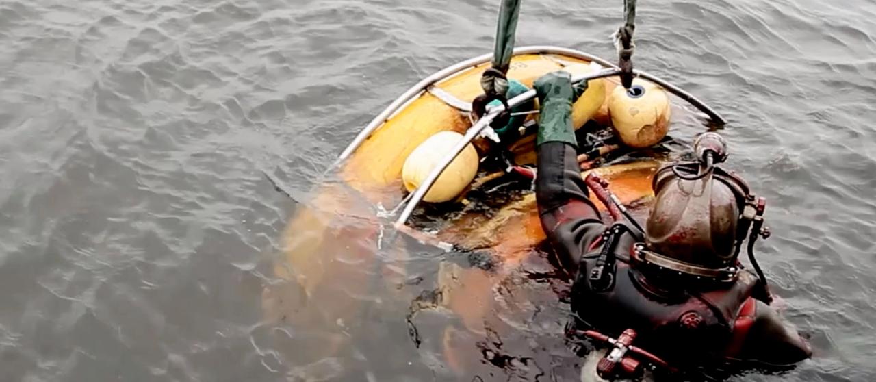 Diver doing underwater hull cleaning