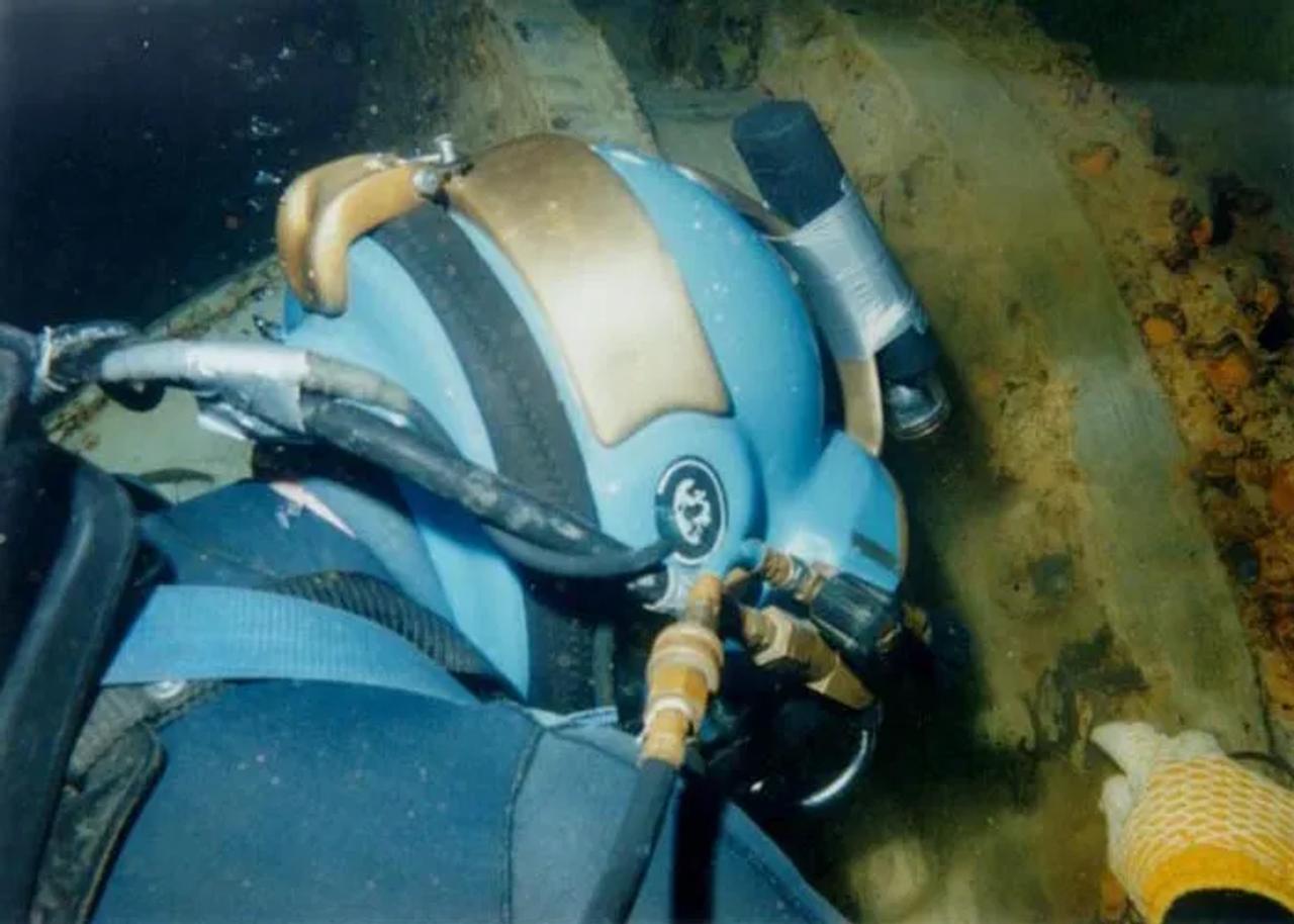 diver inspecting underwater