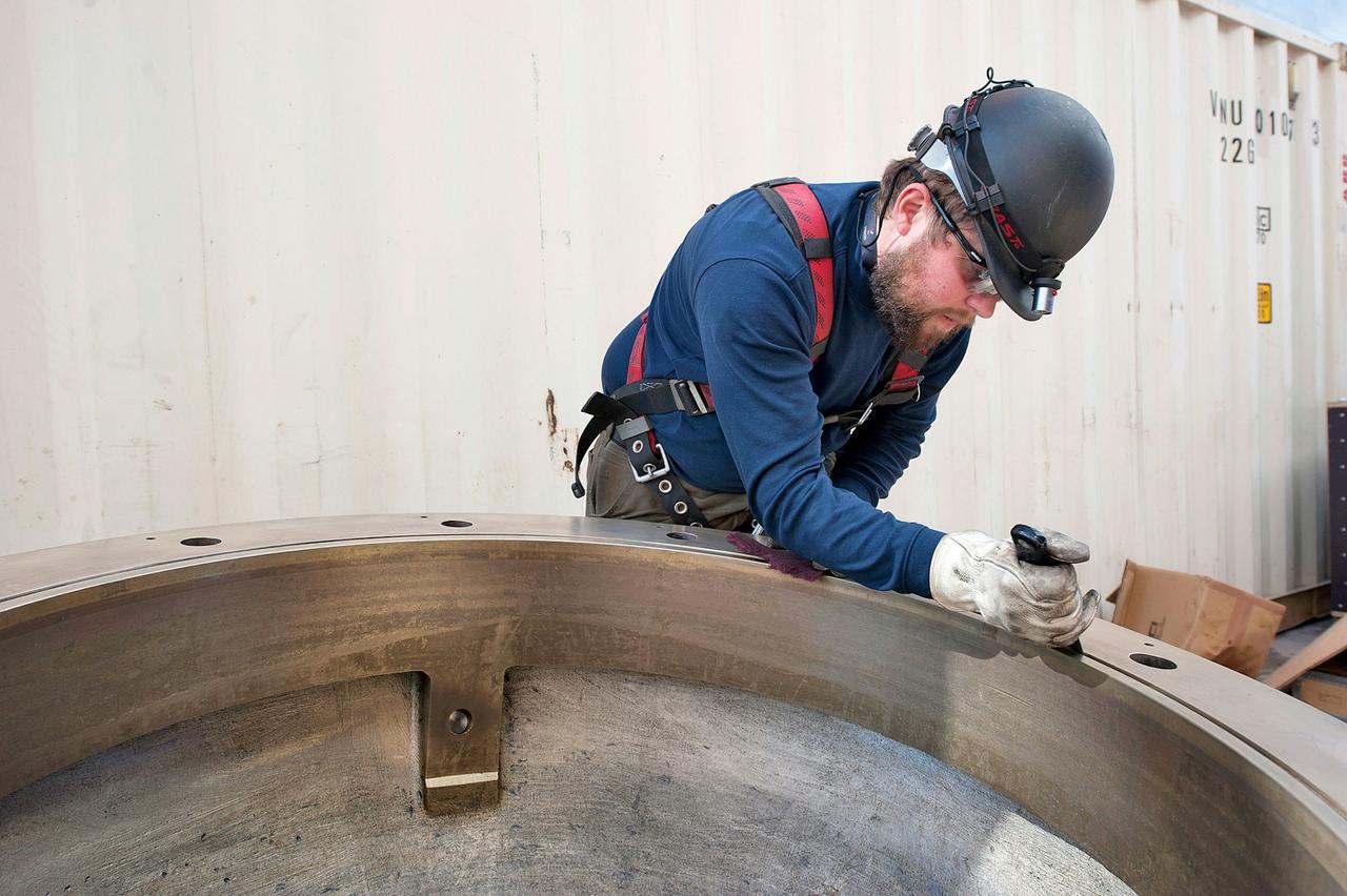 Worker doing an install on the Norwegian Star
