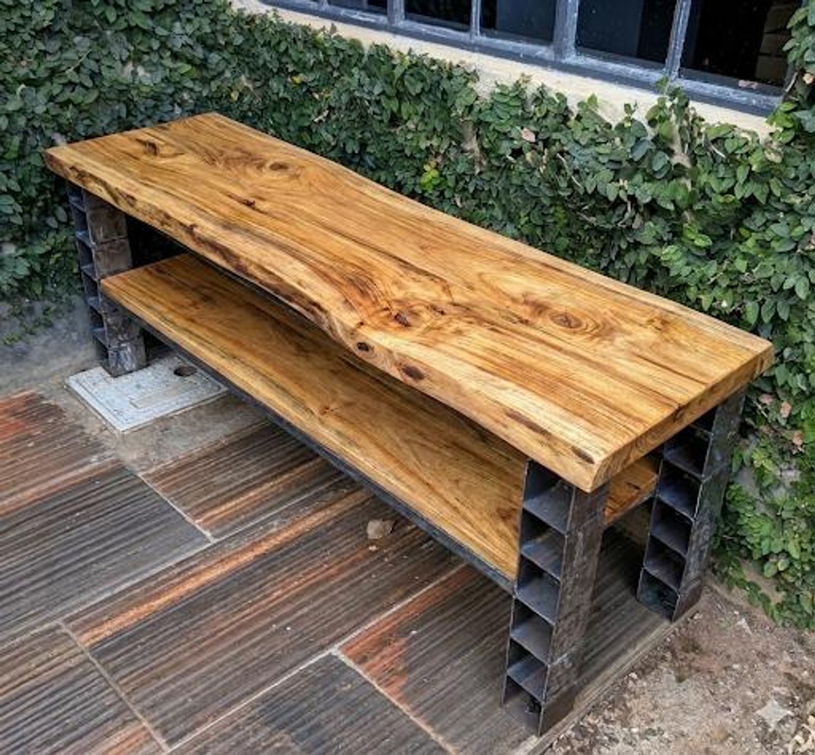 Live-edge wooden bench on cube-grid steel legs