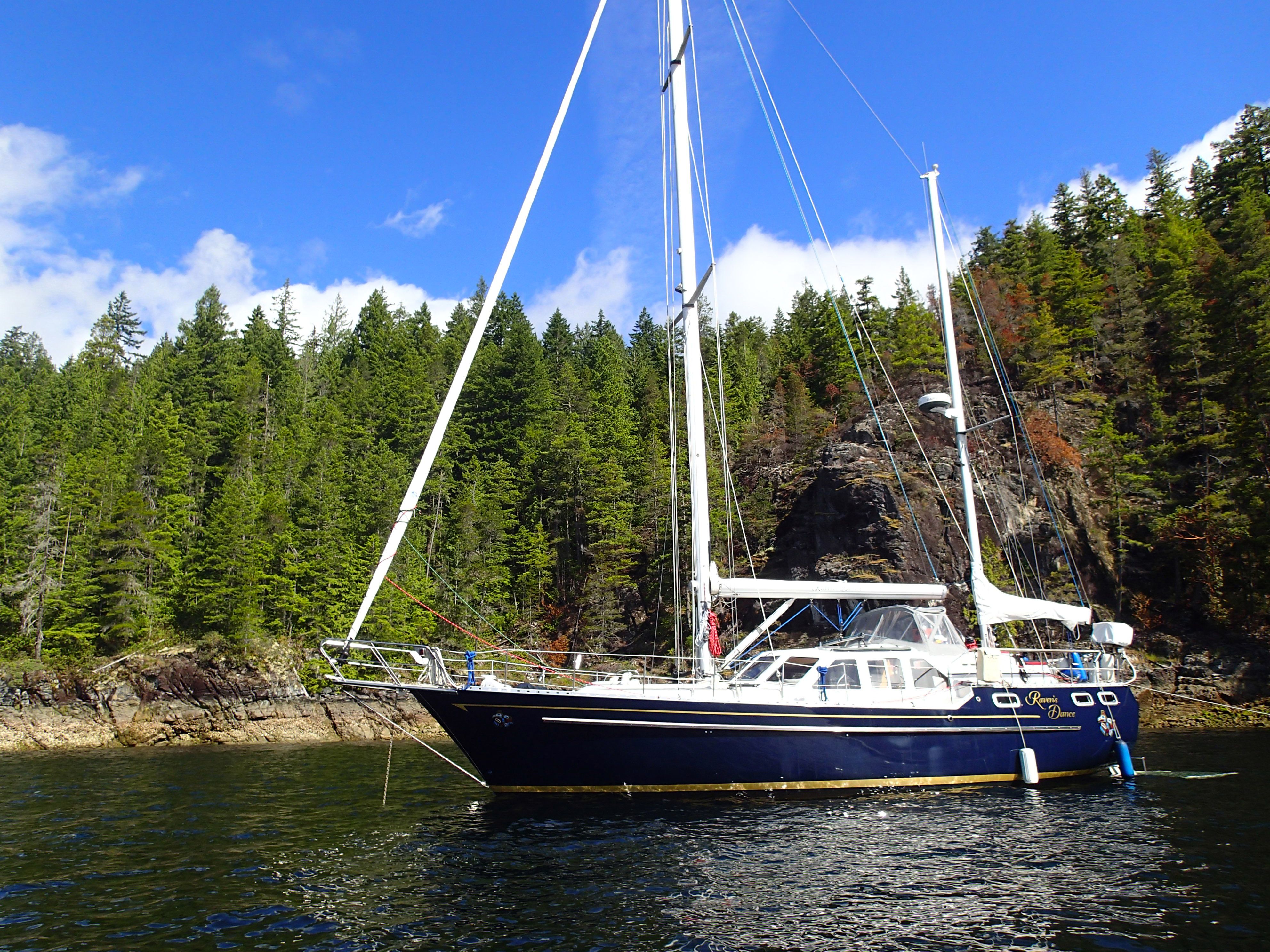 Raven's Dance anchored in a beautiful forested cove