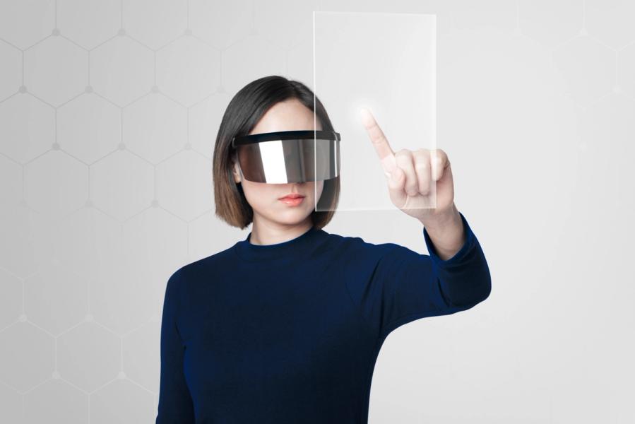 a record player is sitting on a table next to a painting on the wall .