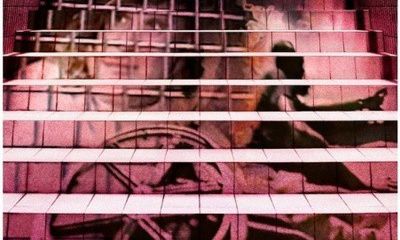An art installation of the image of a wheelchair user projected onto a flight of stairs