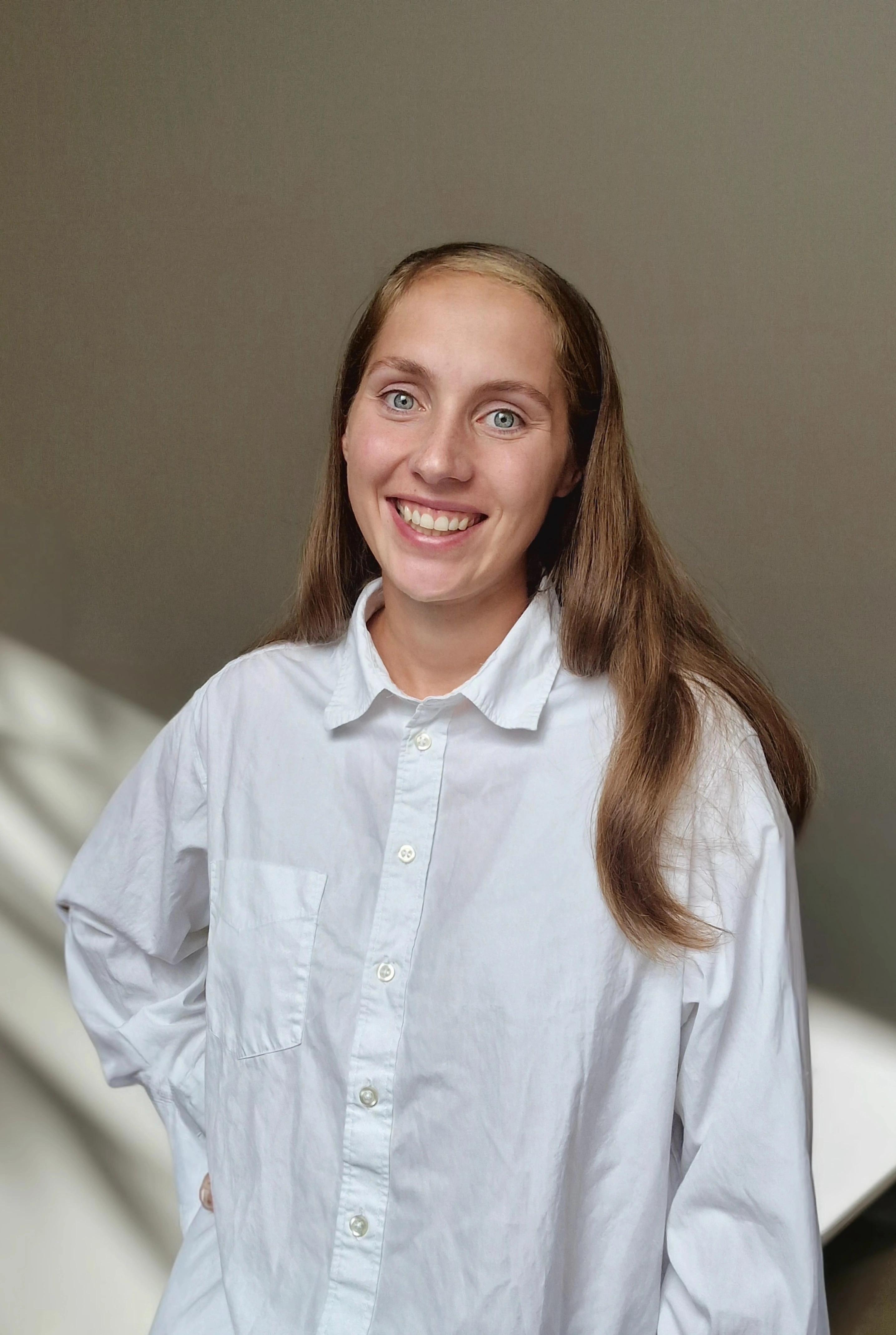 Smiling woman with a white shirt