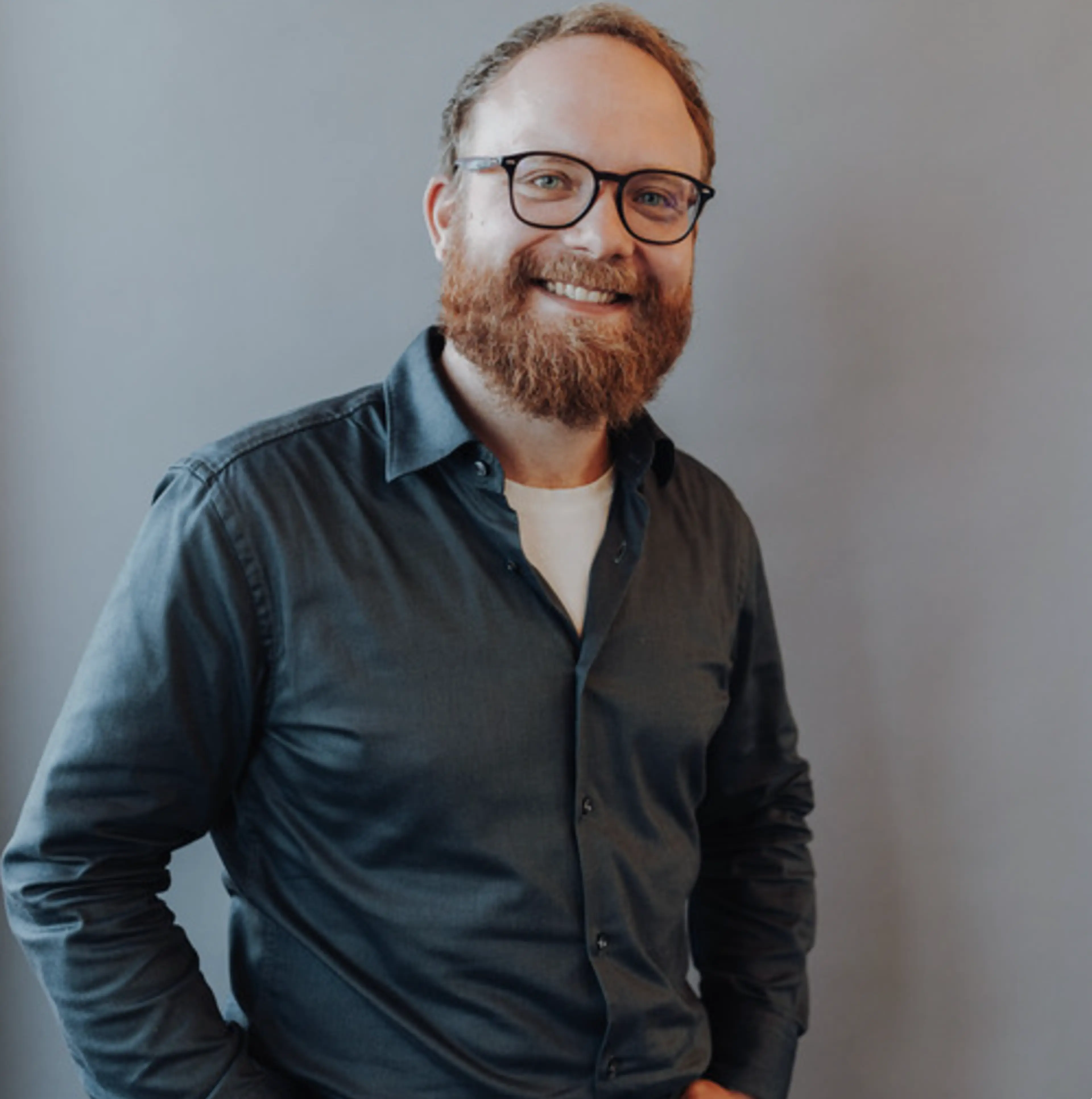 Man with glasses and a green shirt