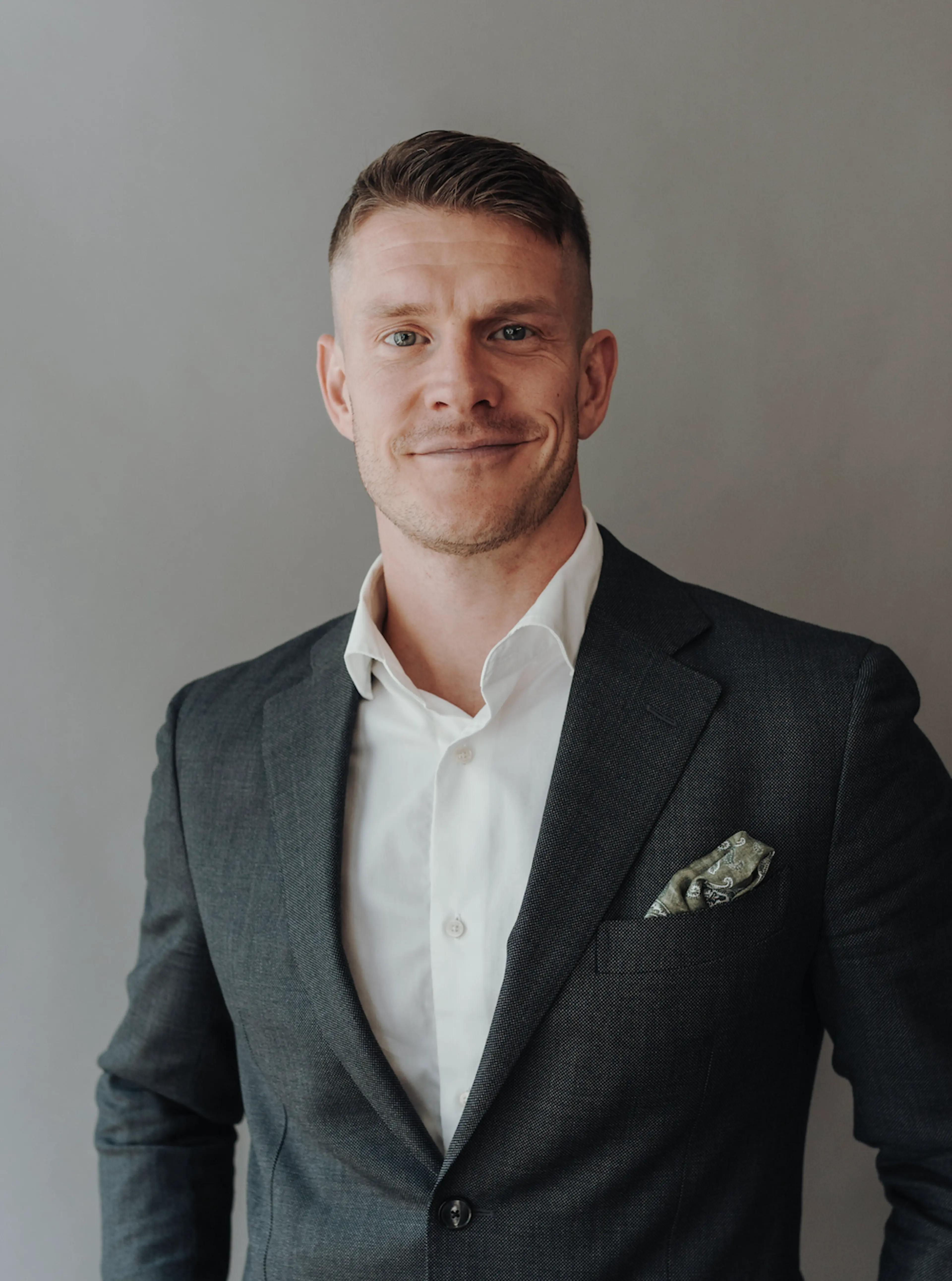 Man wearing a grey suit.