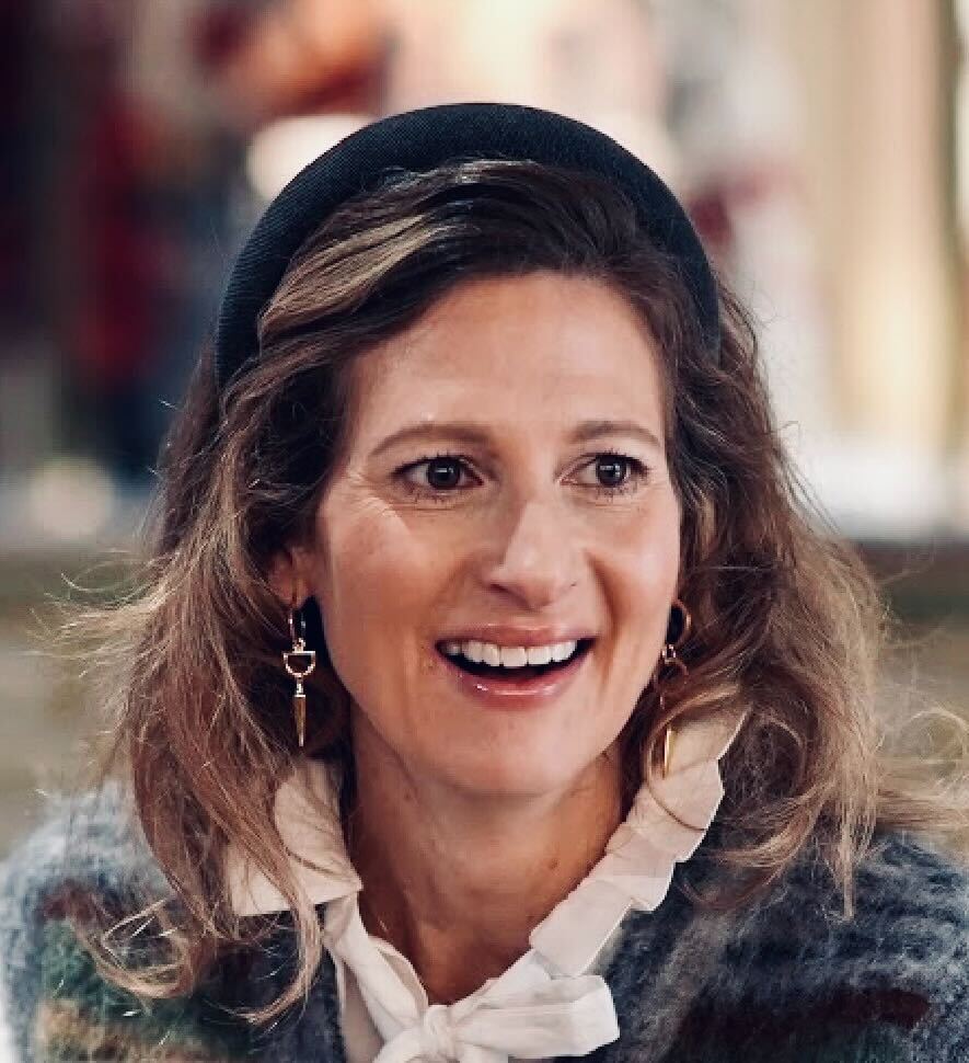 Woman with knitter sweatshirt smiling