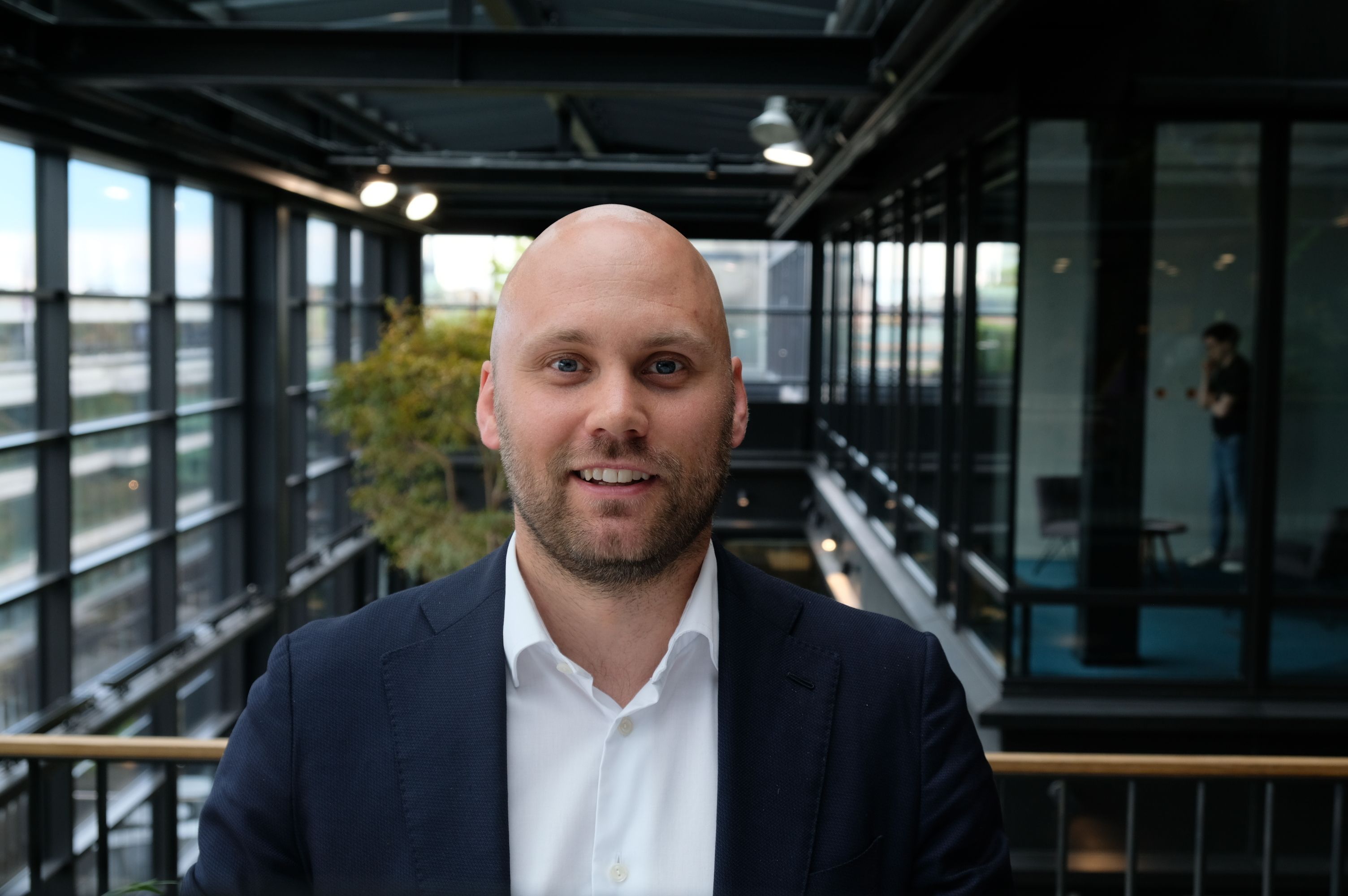 Man in blazer and white button down