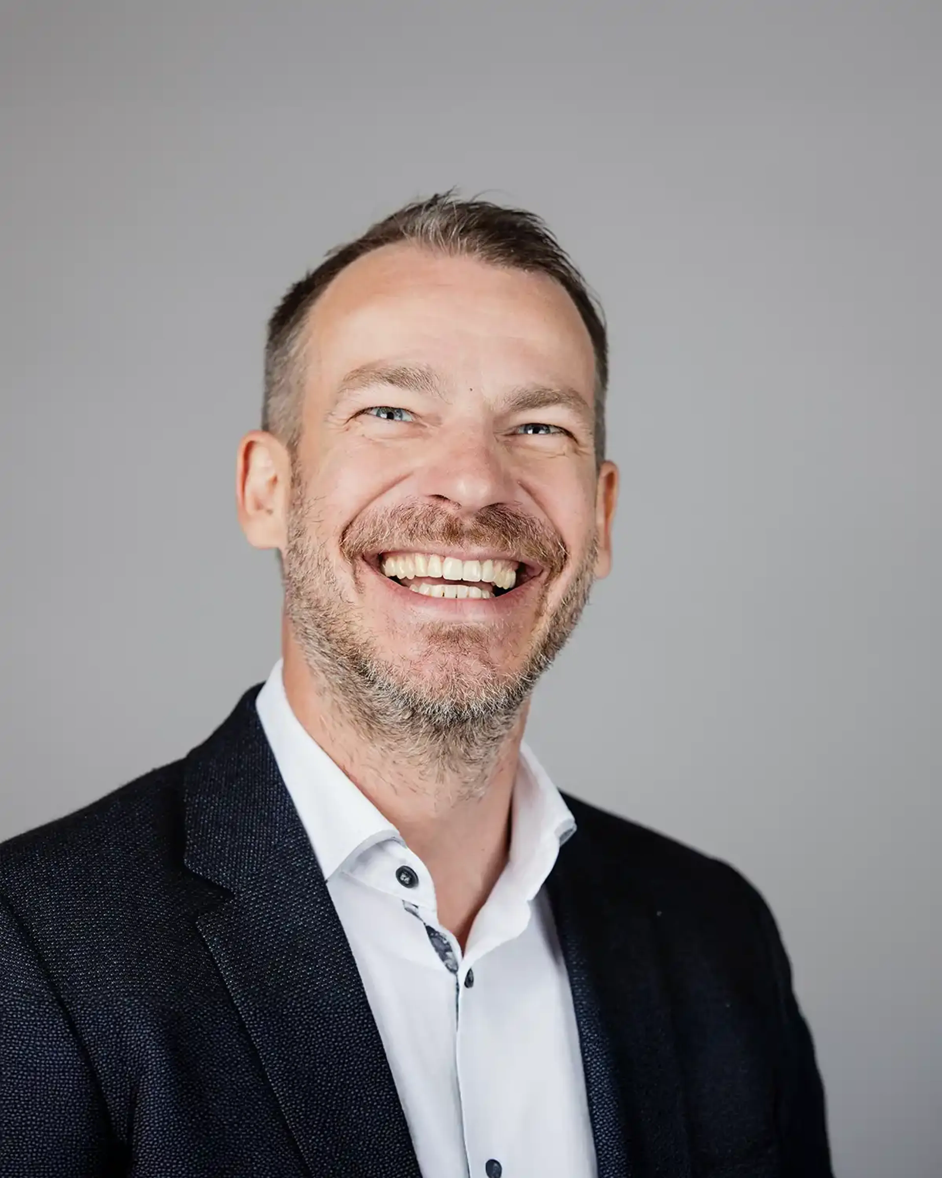 Laughing man with a black suit