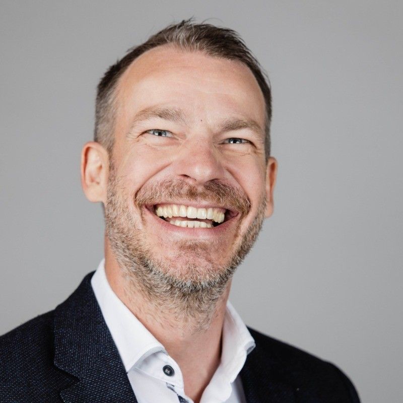 smiling man with a suit