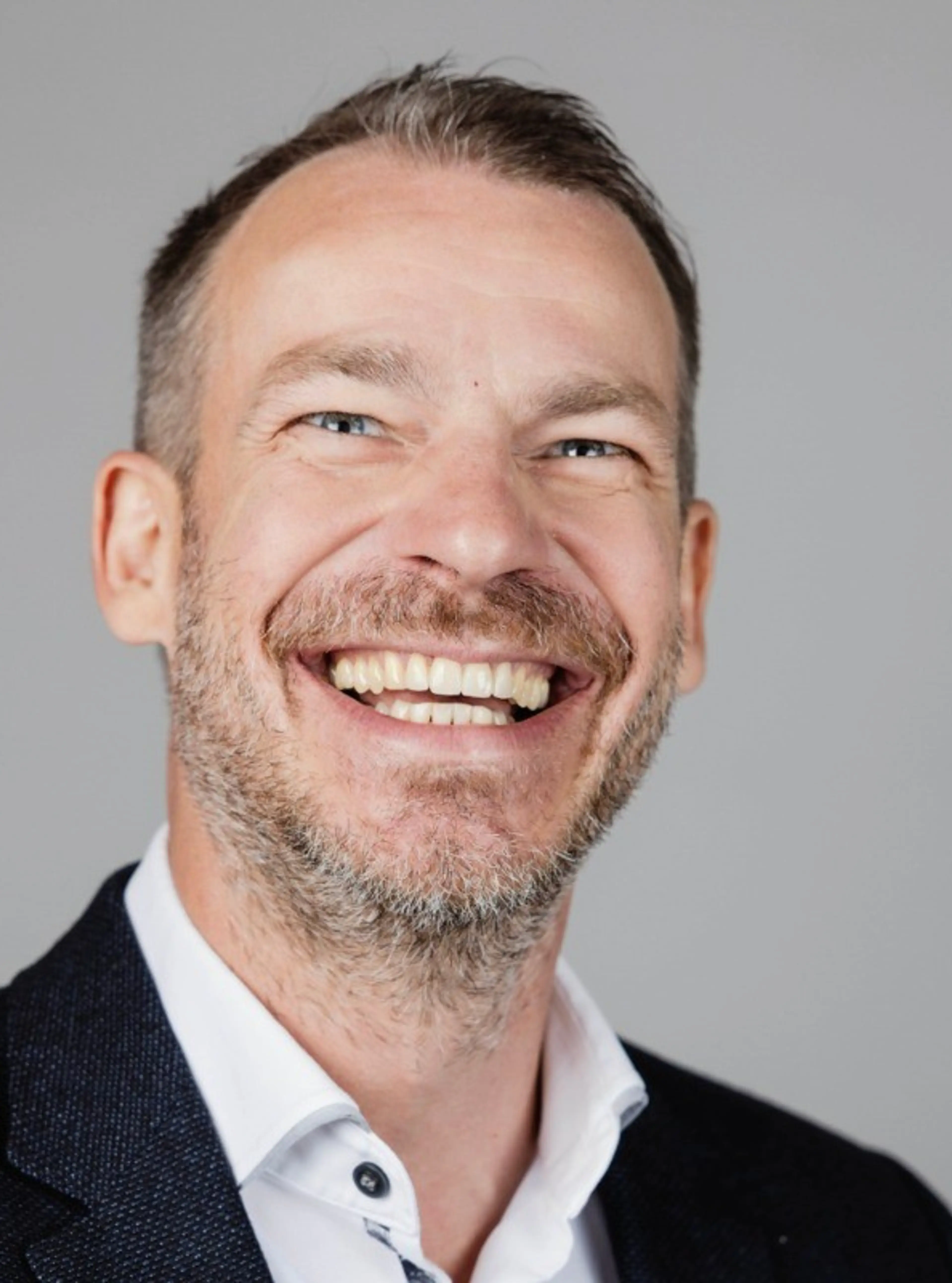 smiling man with a suit