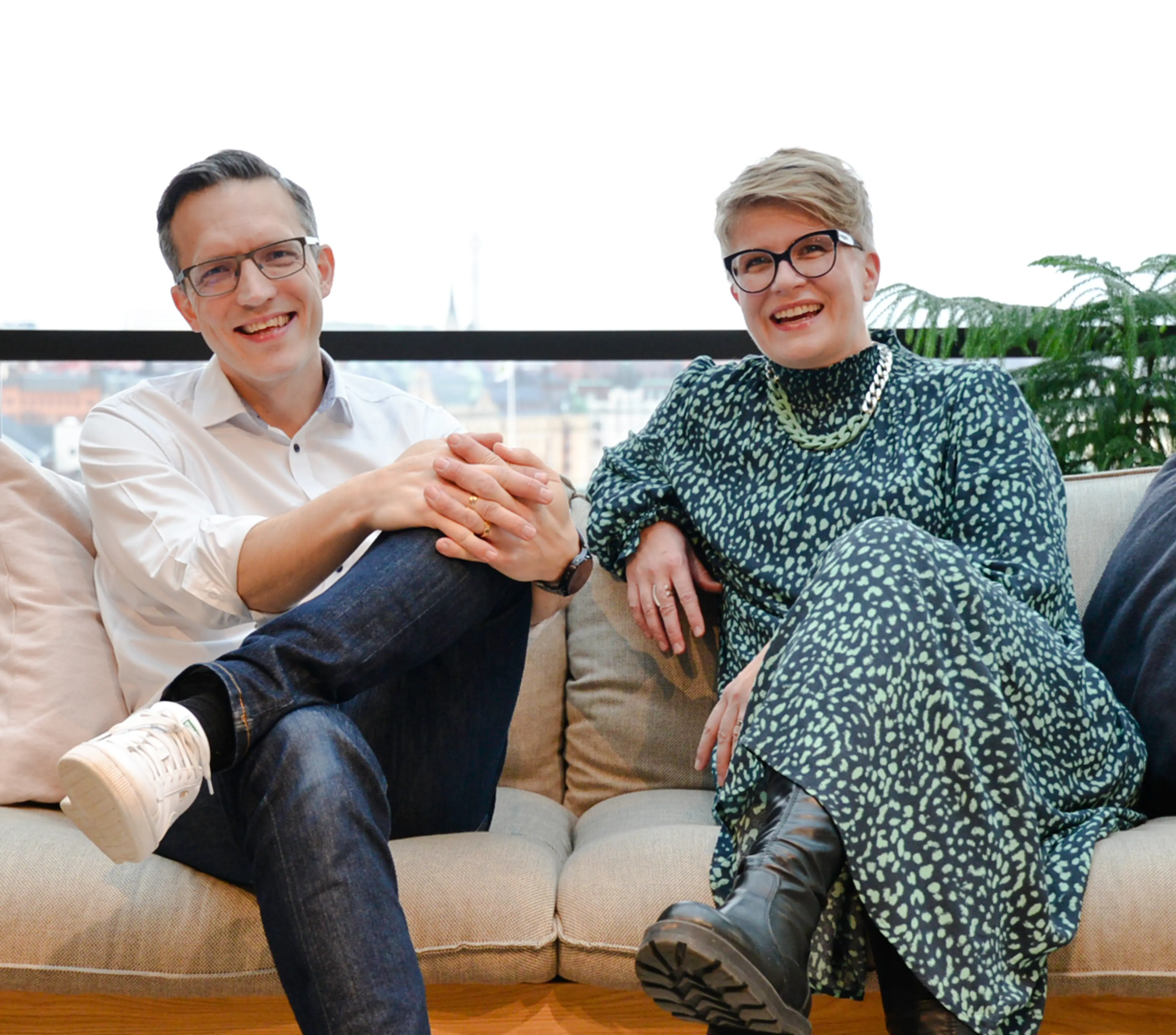 Netlight CEOs Katri and Anders on a sofa