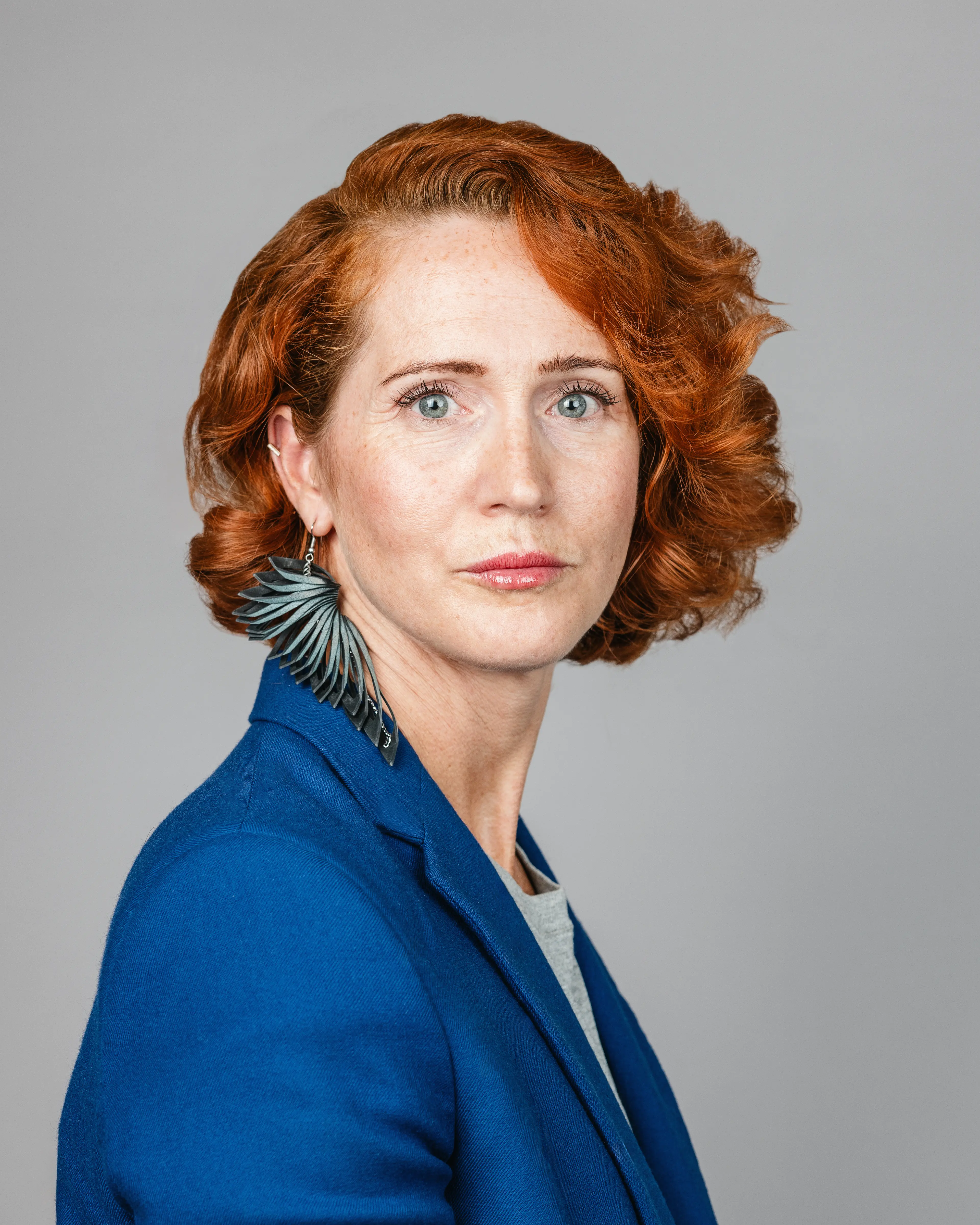 Woman wearing a blue blazer.