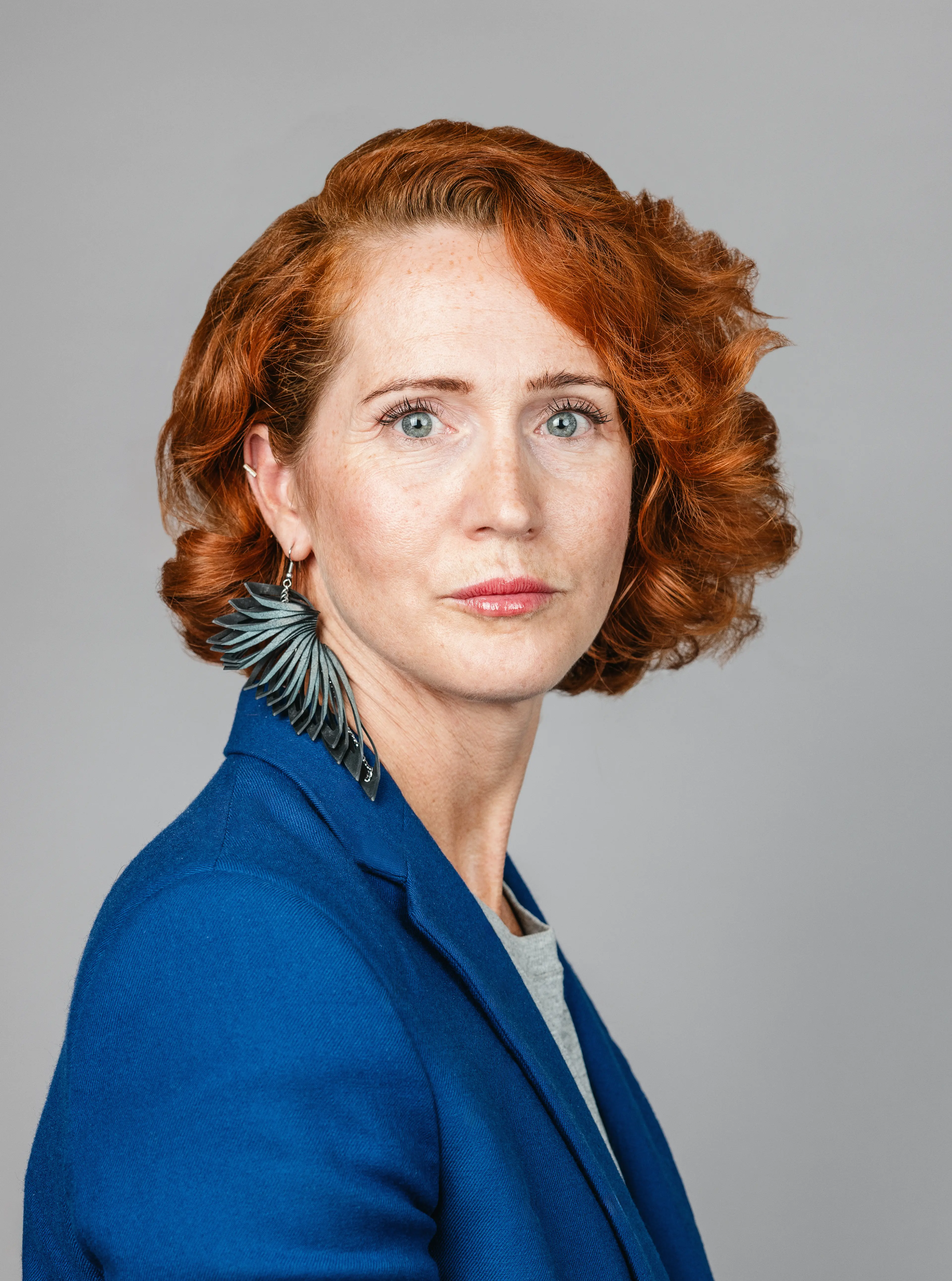 Woman wearing a blue blazer.