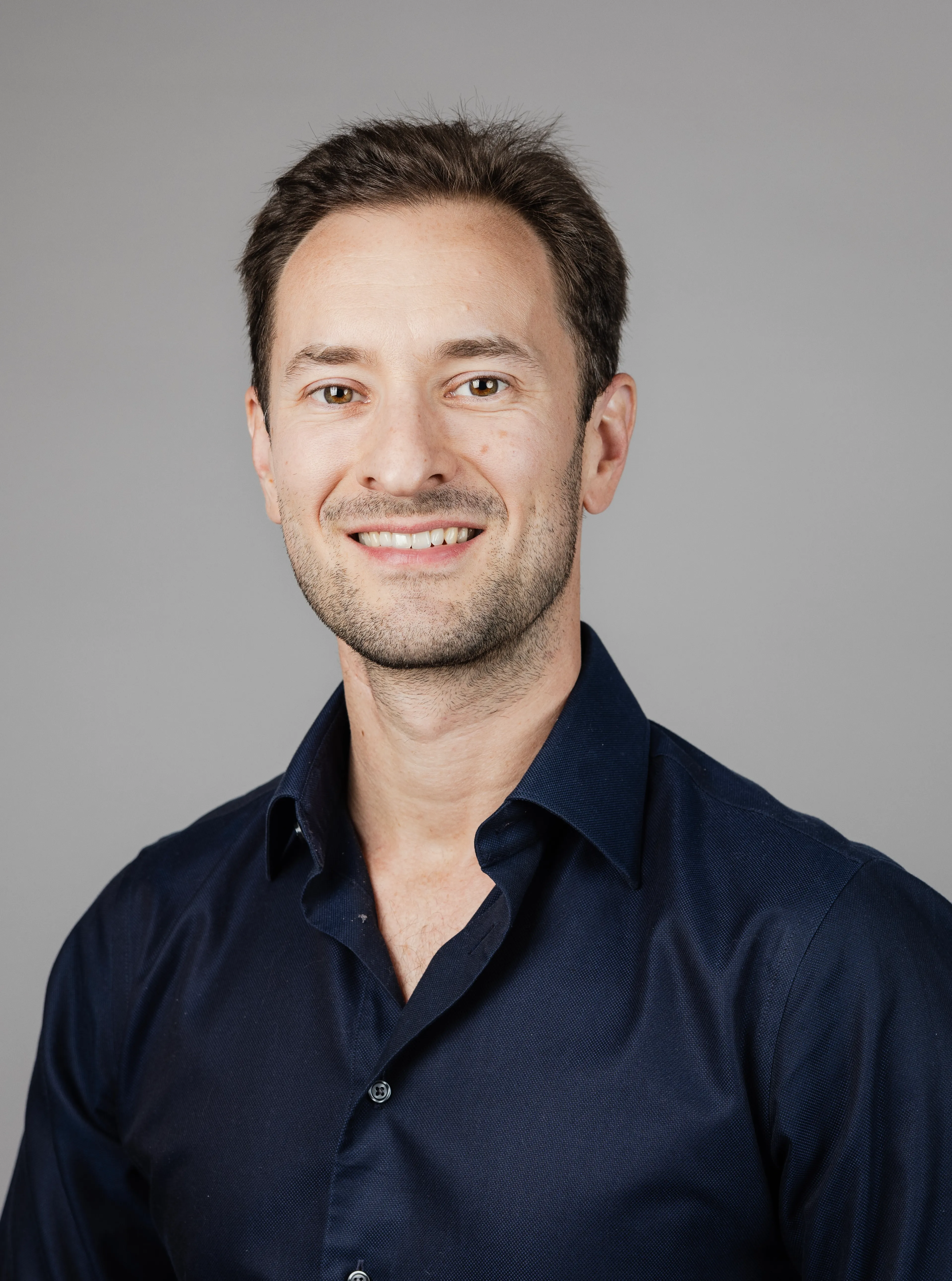 Smiling man with a blue shirt