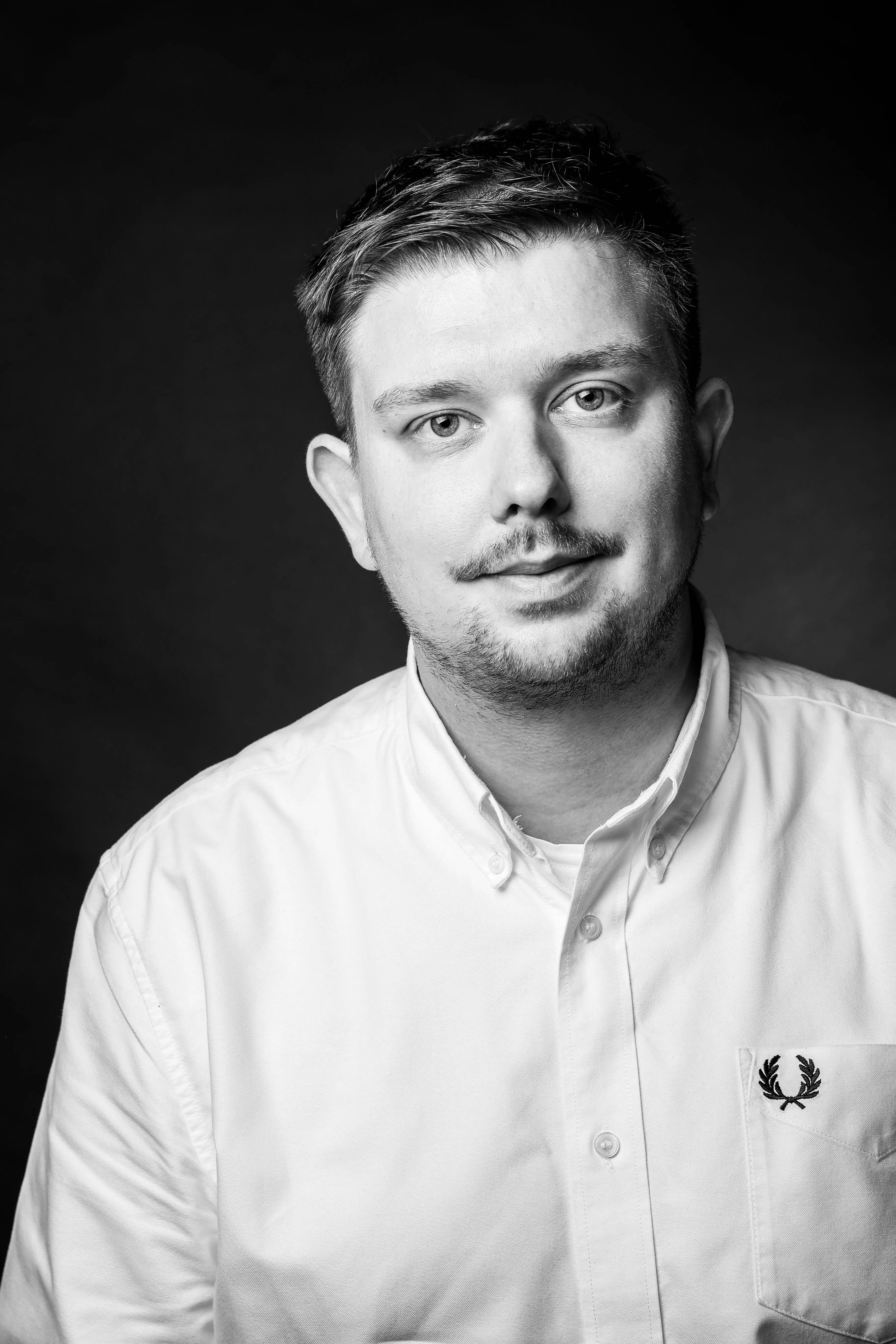 Man with a white shirt.