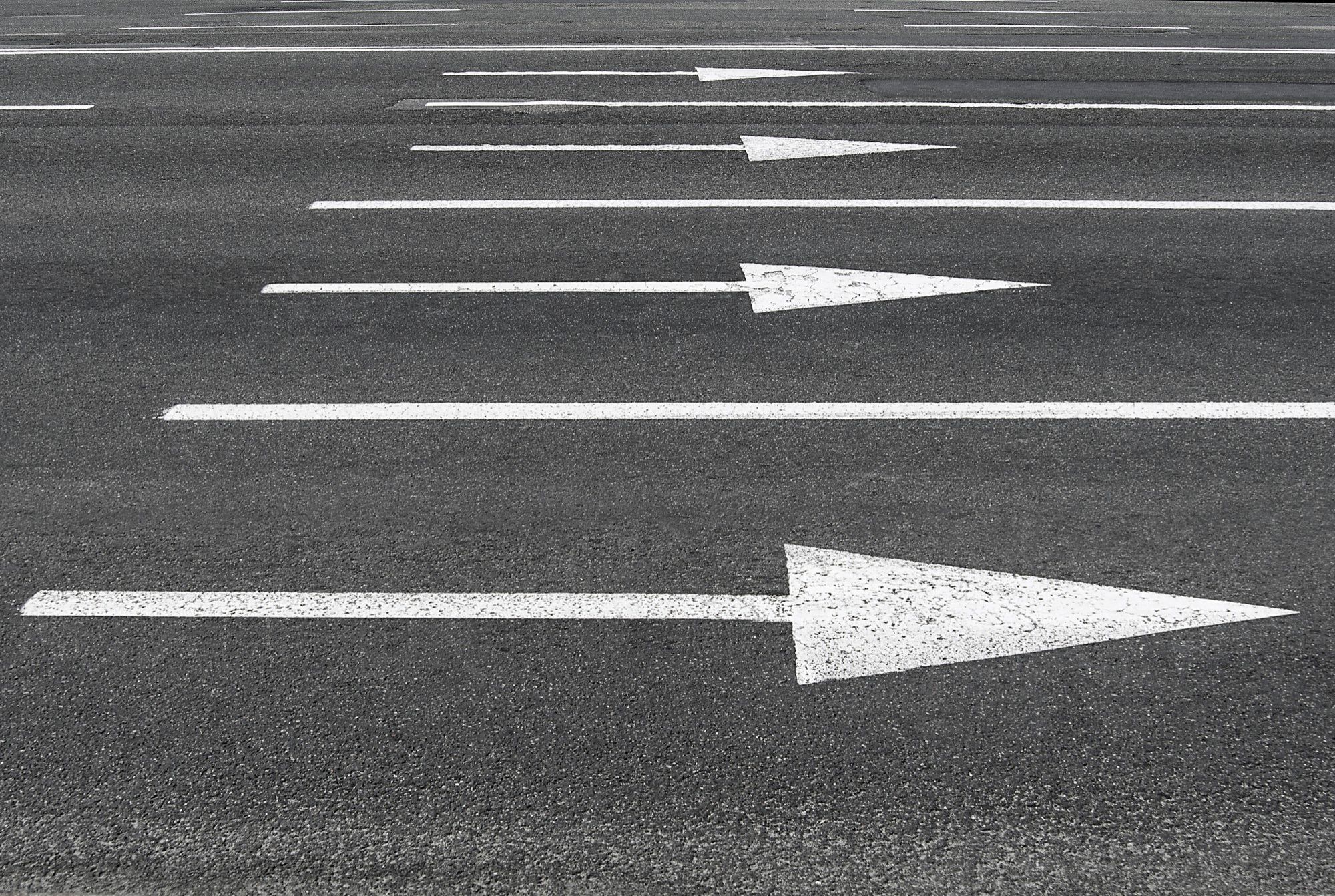 White road signs on a street