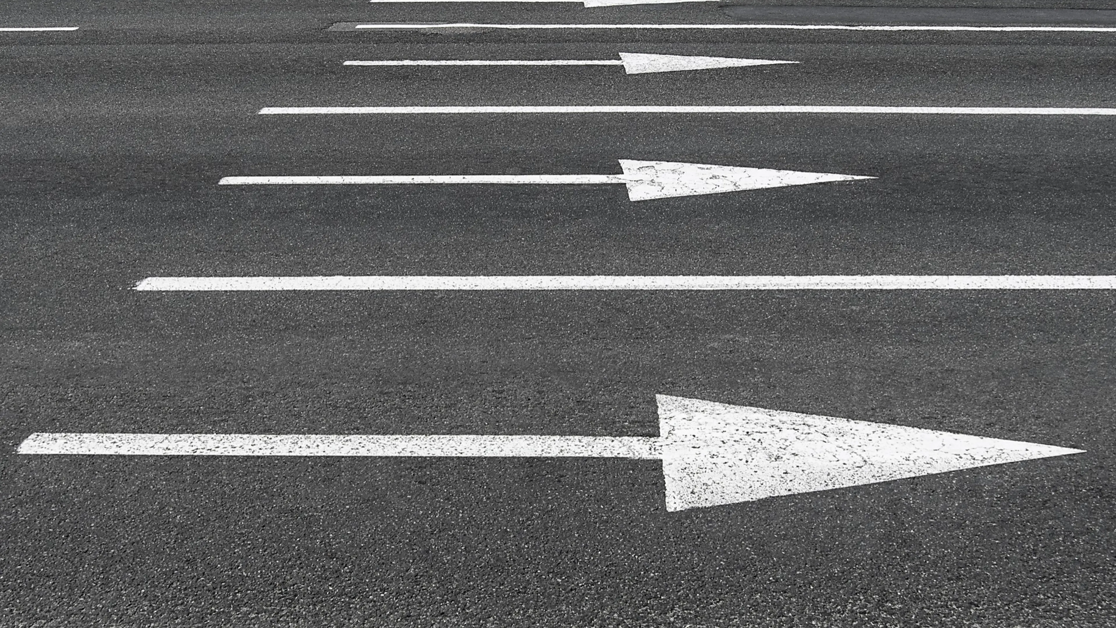 White road signs on a street