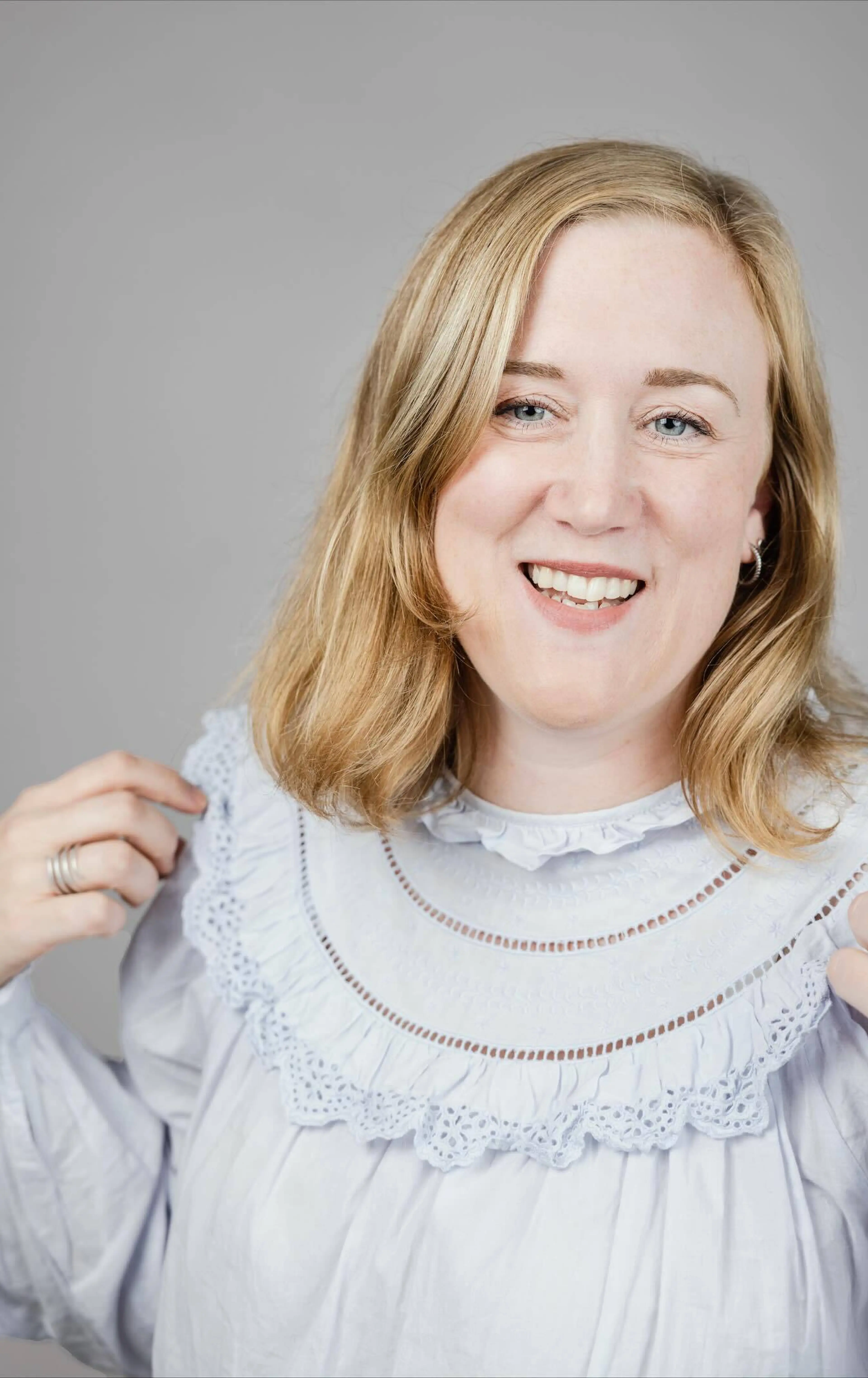 Woman holding hands on shoulders