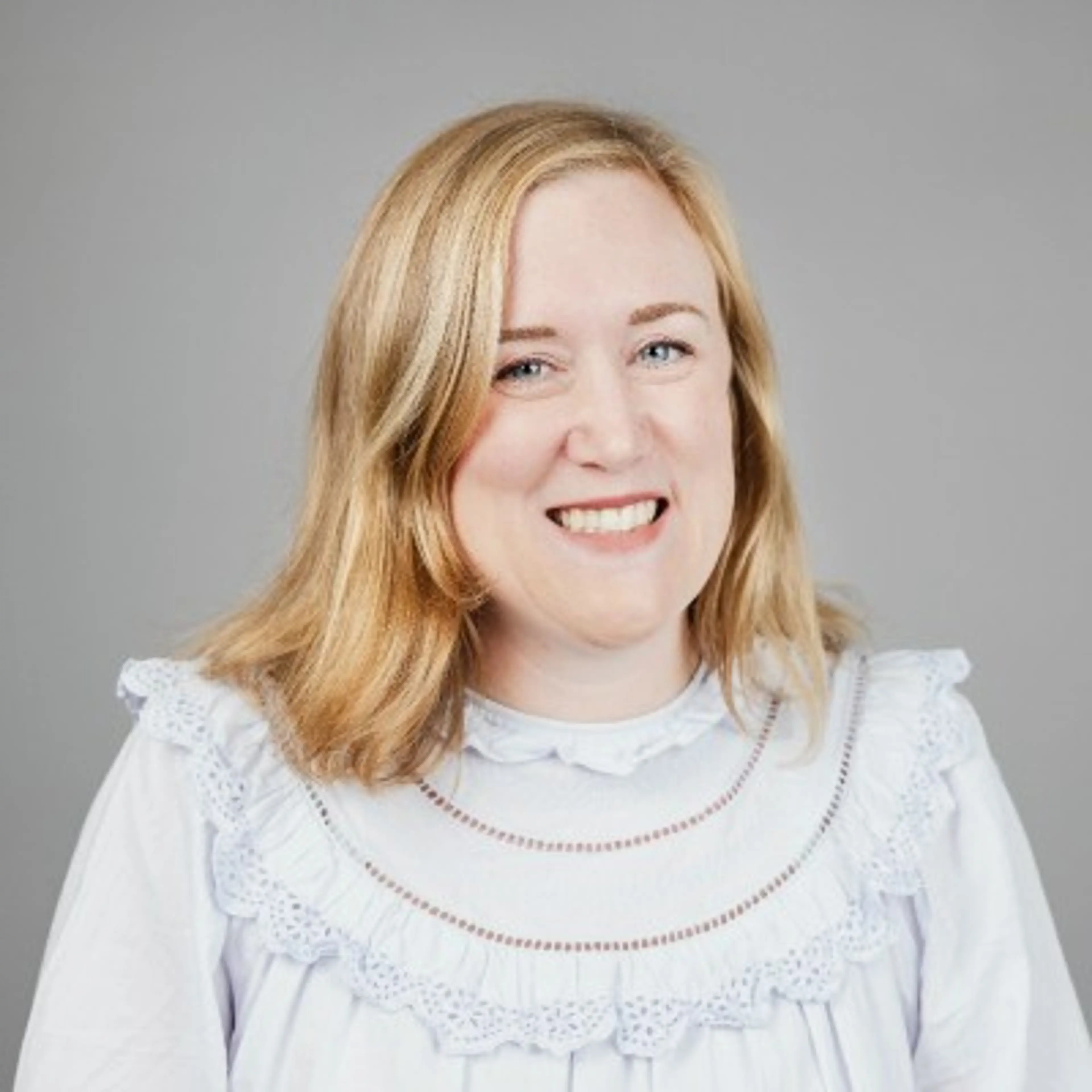 Woman wearing a white shirt.