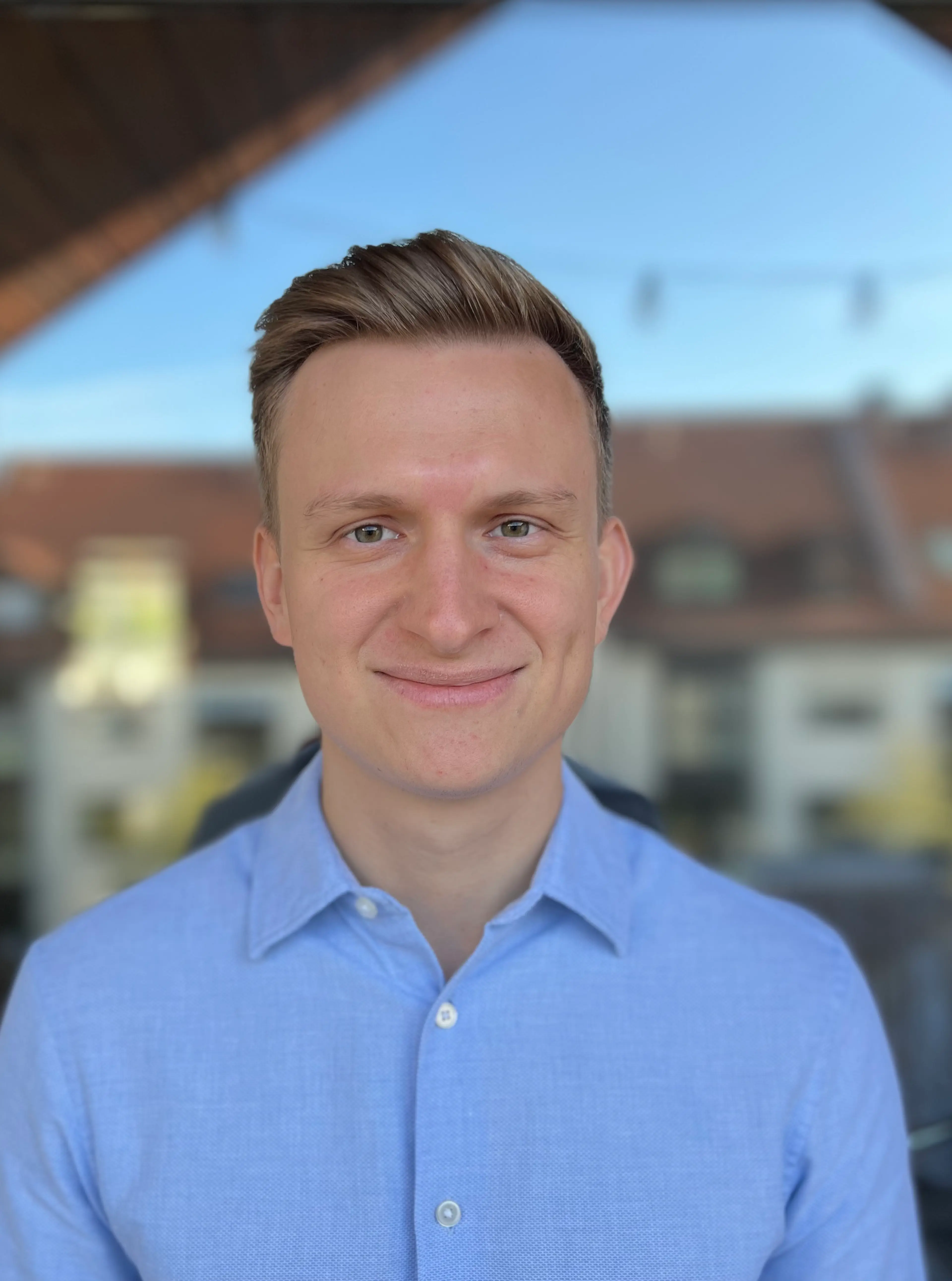 Smiling man wearing a blue shirt