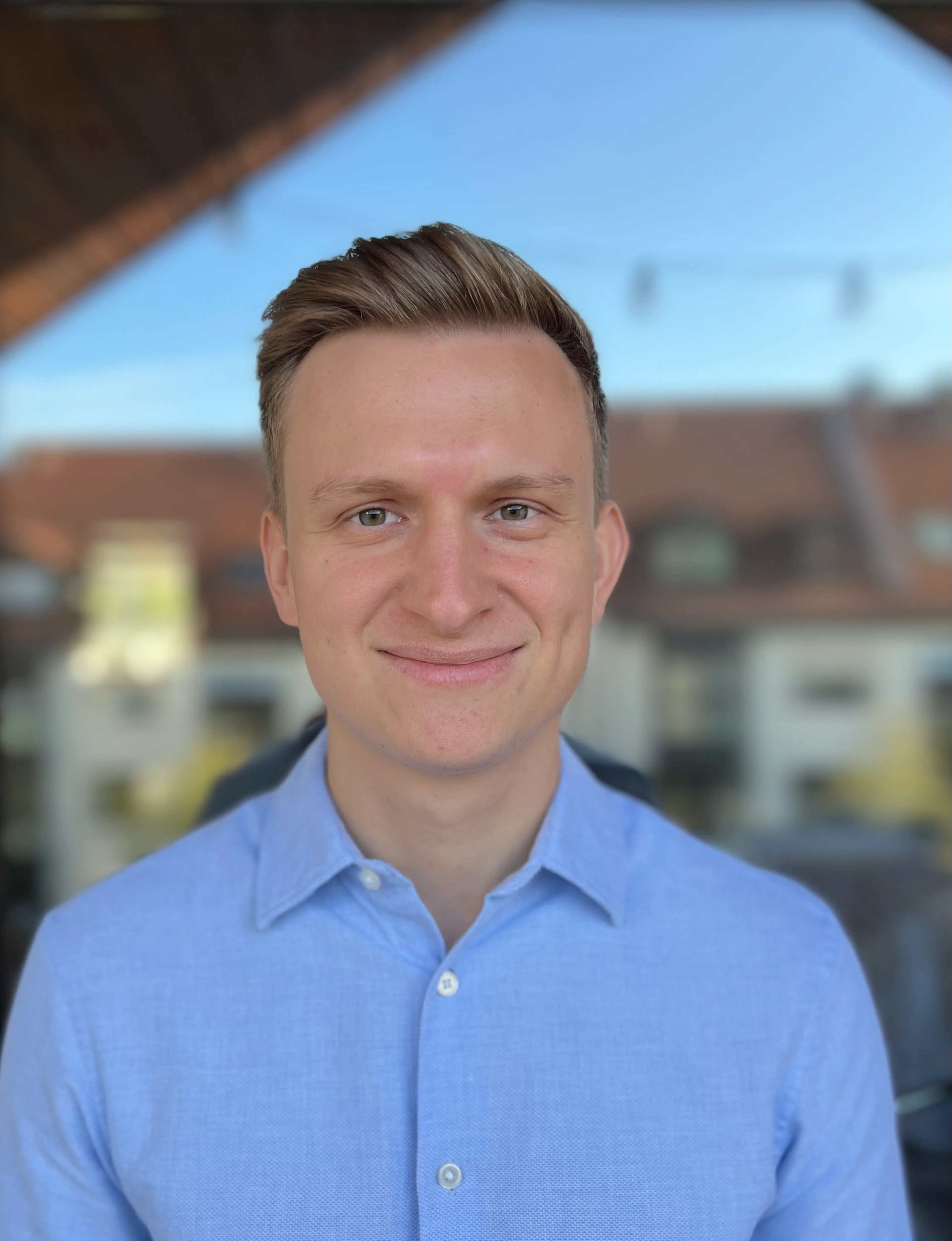 Smiling man wearing a blue shirt