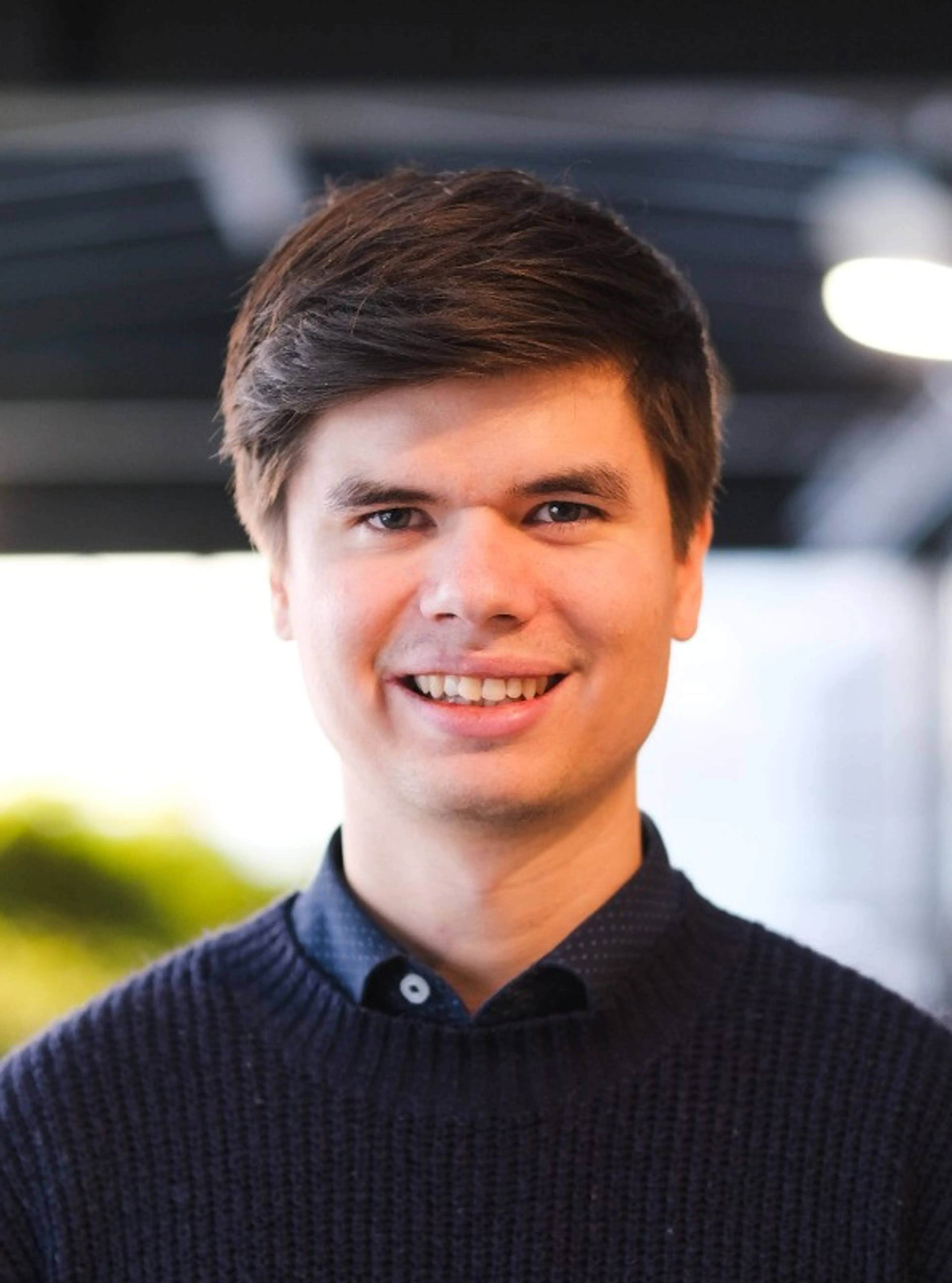 Smiling man with blue shirt
